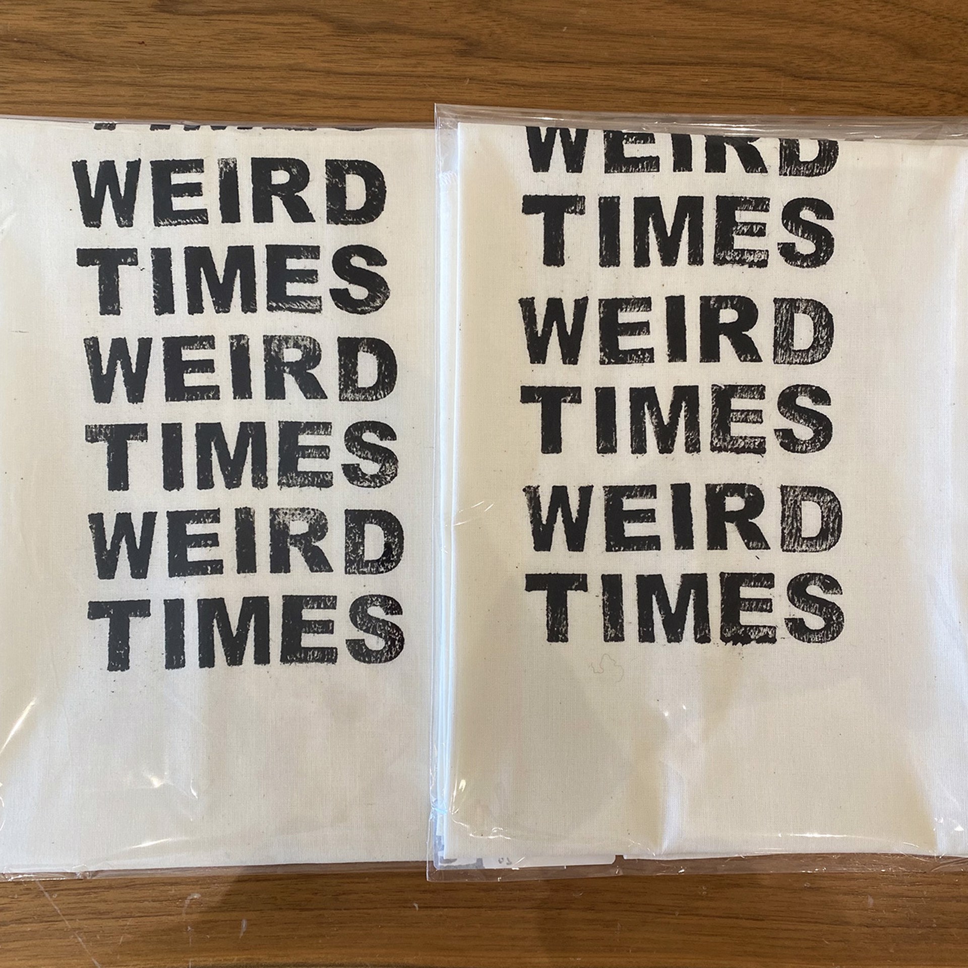 Weird Times Tea Towel, White Cotton with White Stitching by Liz Pead
