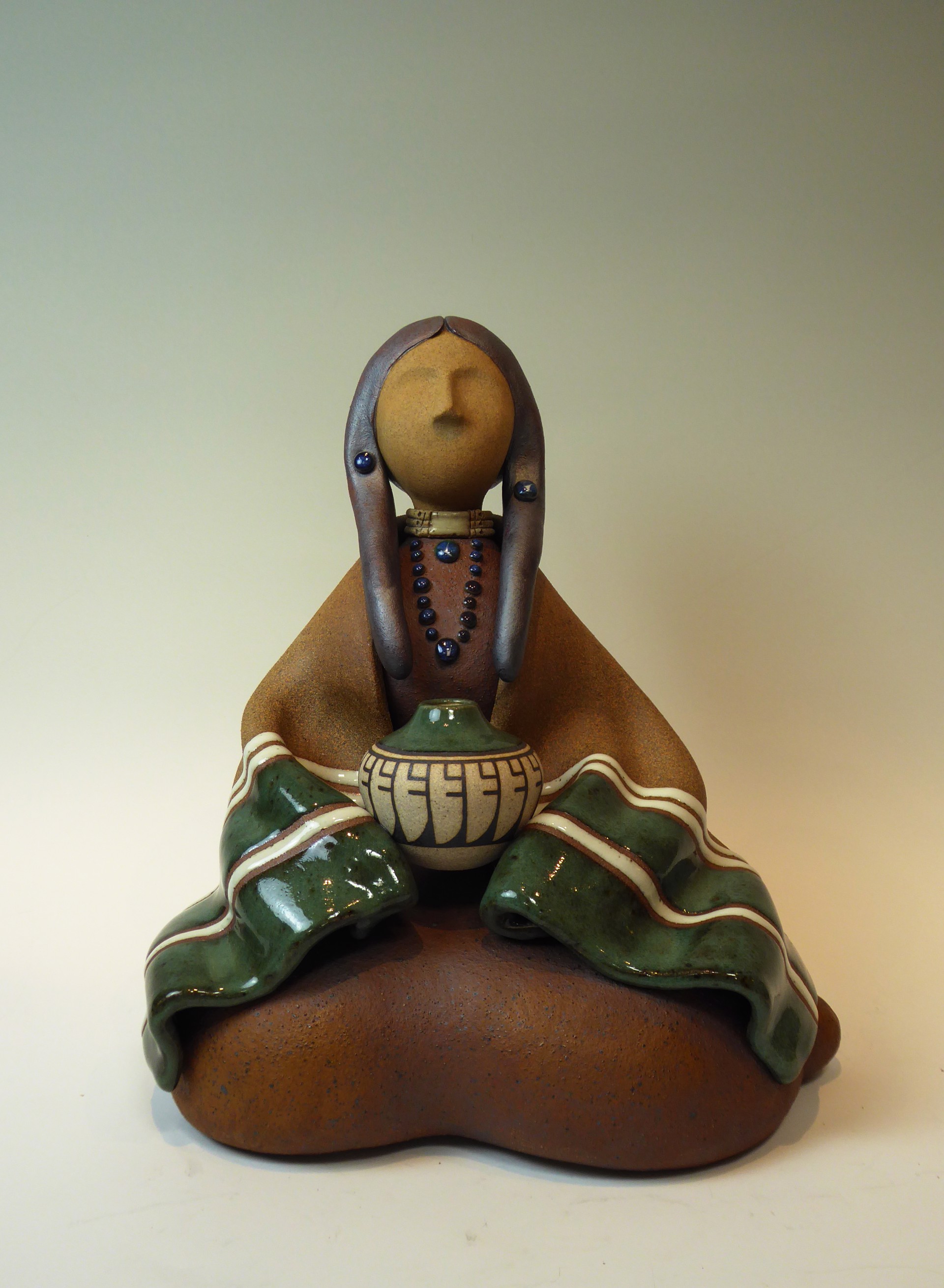 Lakota Woman Seated Green  by Terry Slonaker