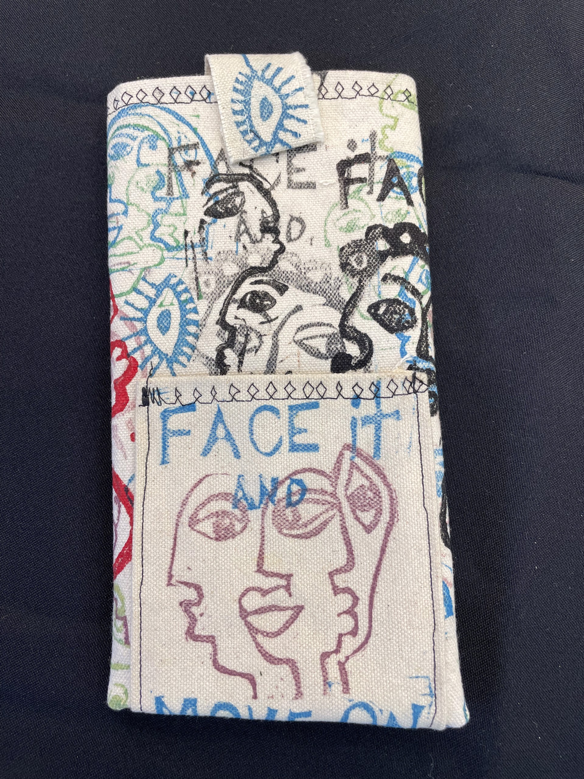 "Face It" Phone Bed (printed canvas mobile phone holder by Toni Lane) by Toni Lane