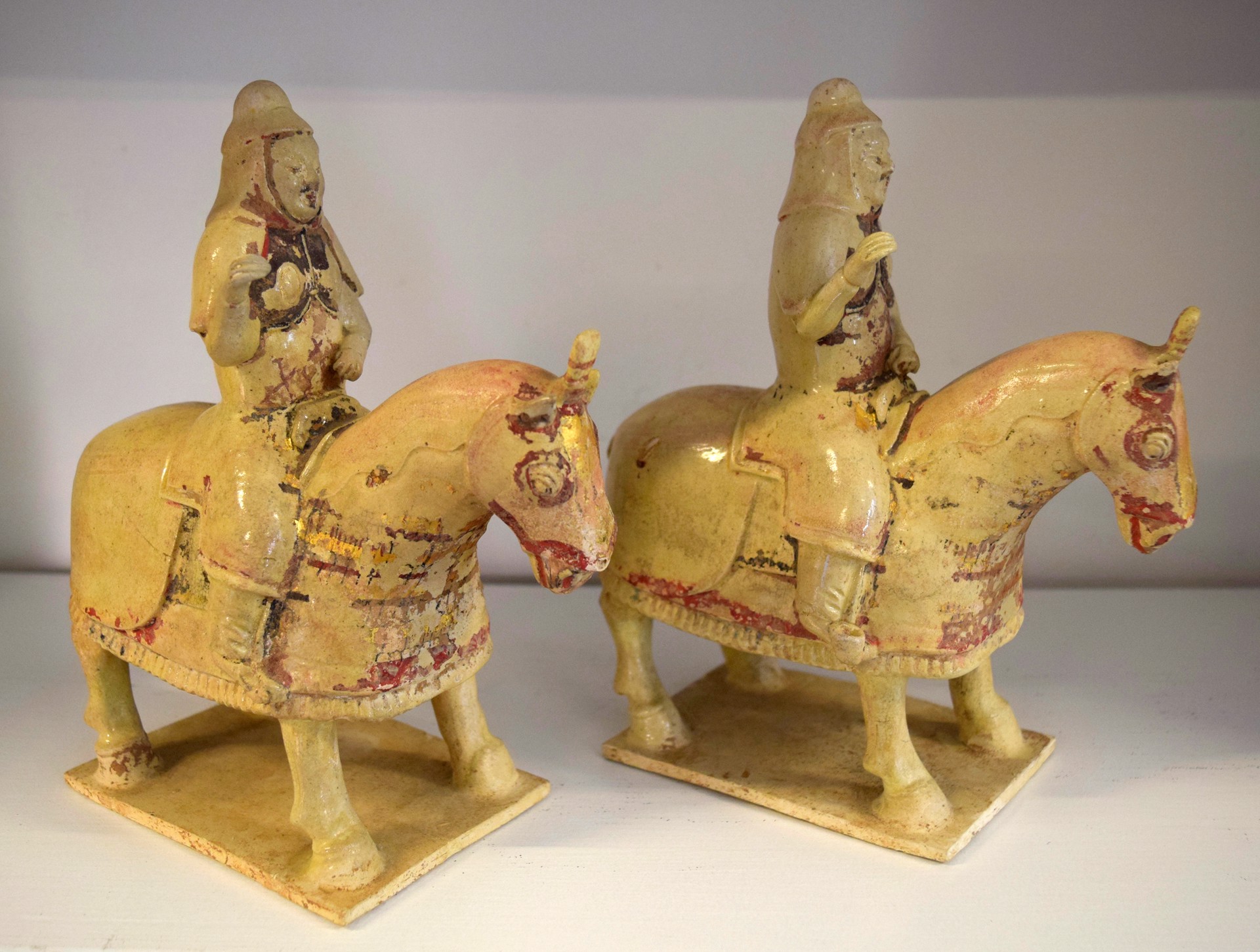 PAIR OF SMALL STRAW-GLAZED POTTERY of ARMORED EQUESTRIANS