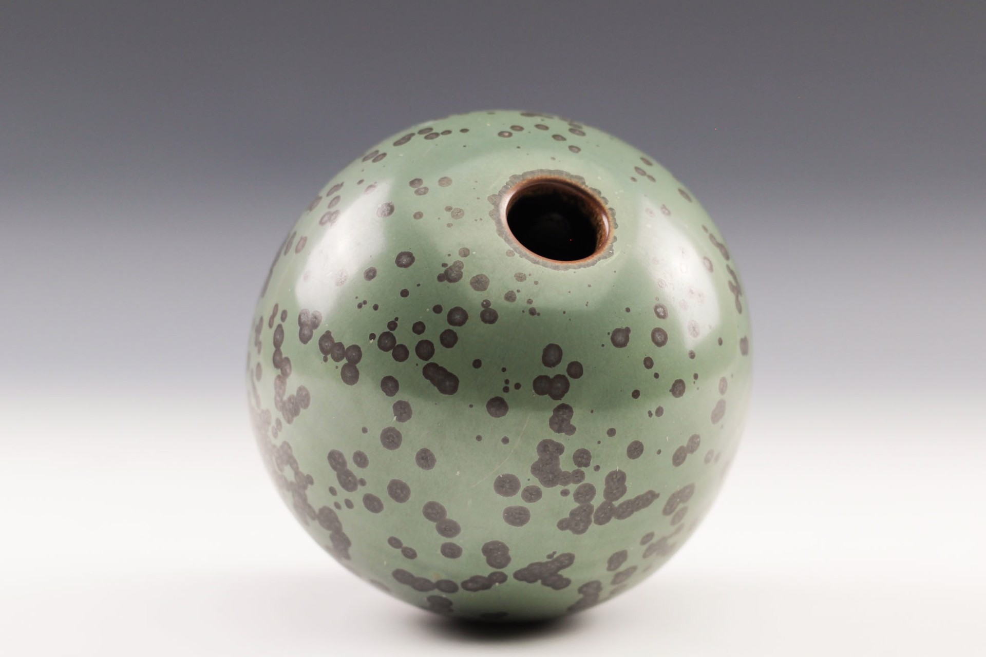 Enclosed form with White Bead by Charlie Olson