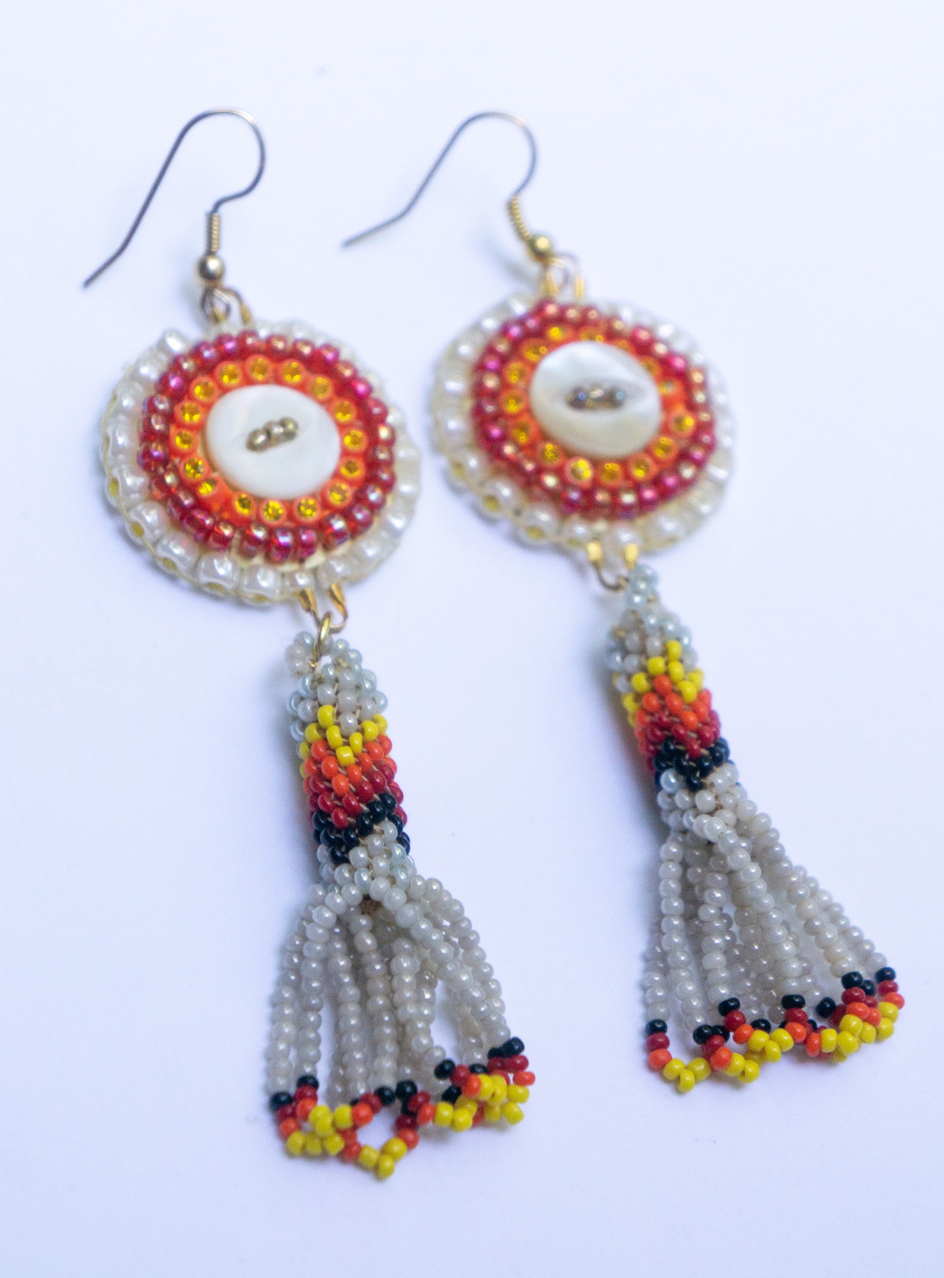 Beaded dangle earrings by Hattie Lee Mendoza