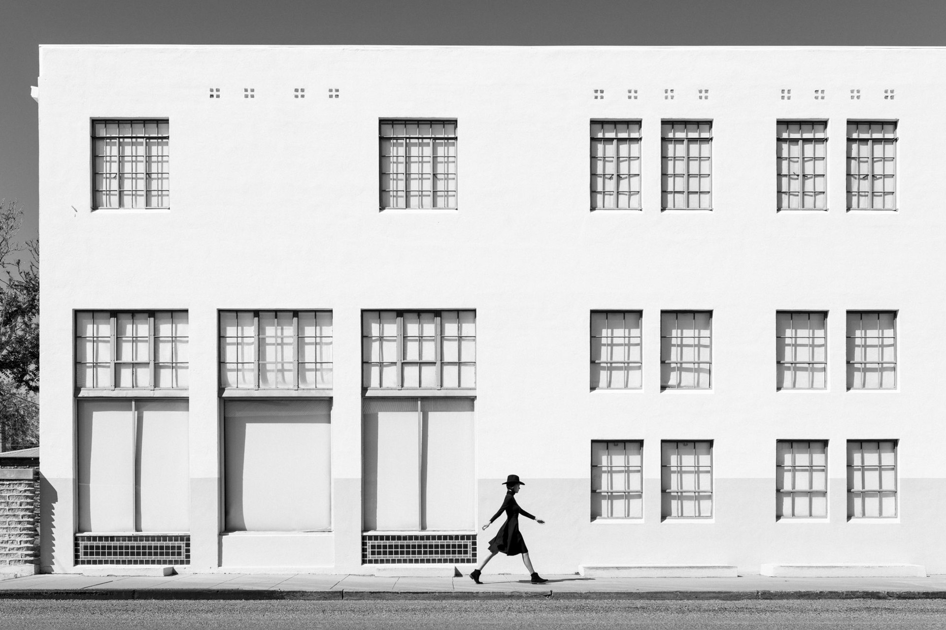 Kate Walking Marfa White Building by Thom Jackson
