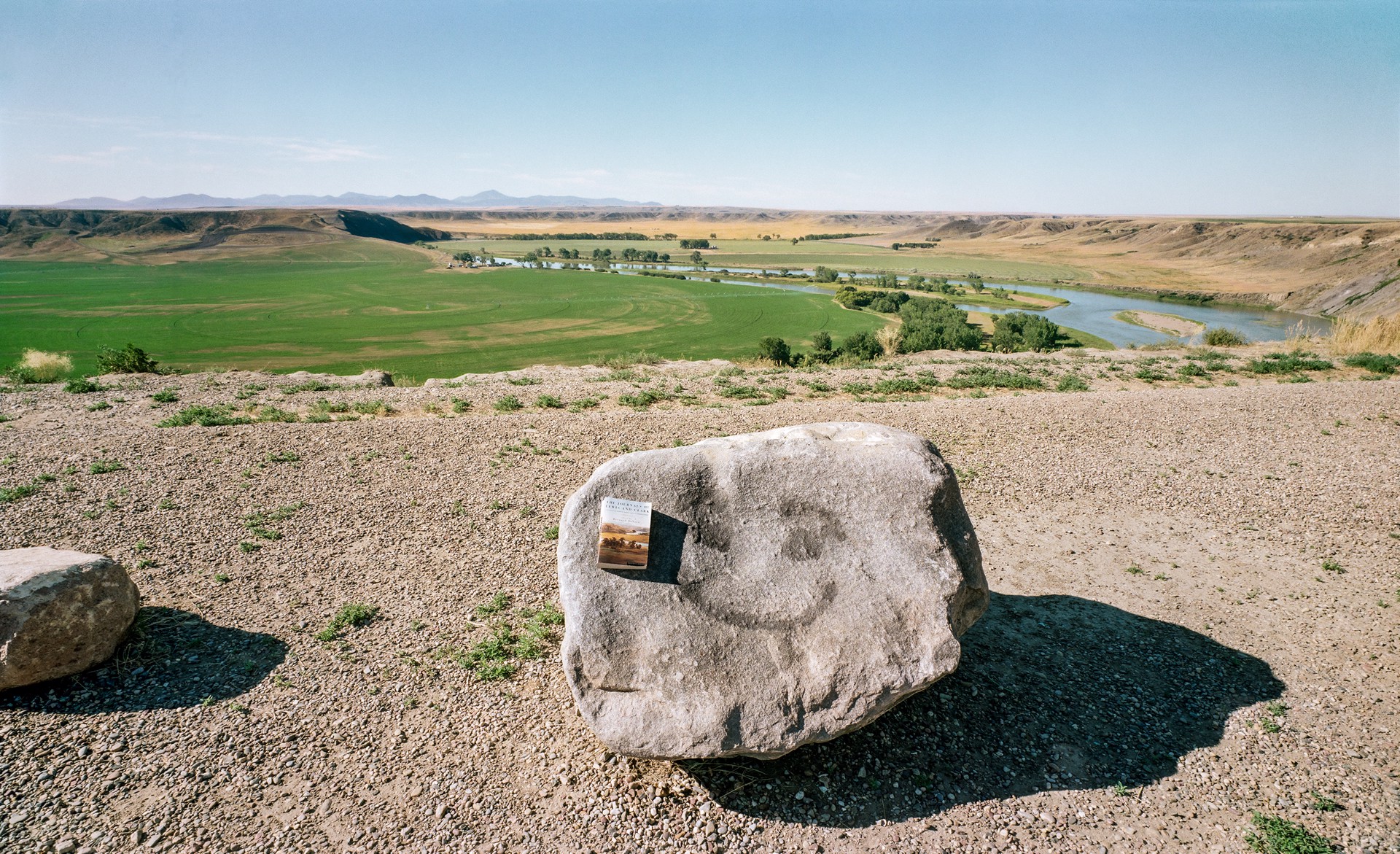 Kool Aid Happy Face, Missouri River Overlook, Near Fort Benton, Montana by Lawrence McFarland