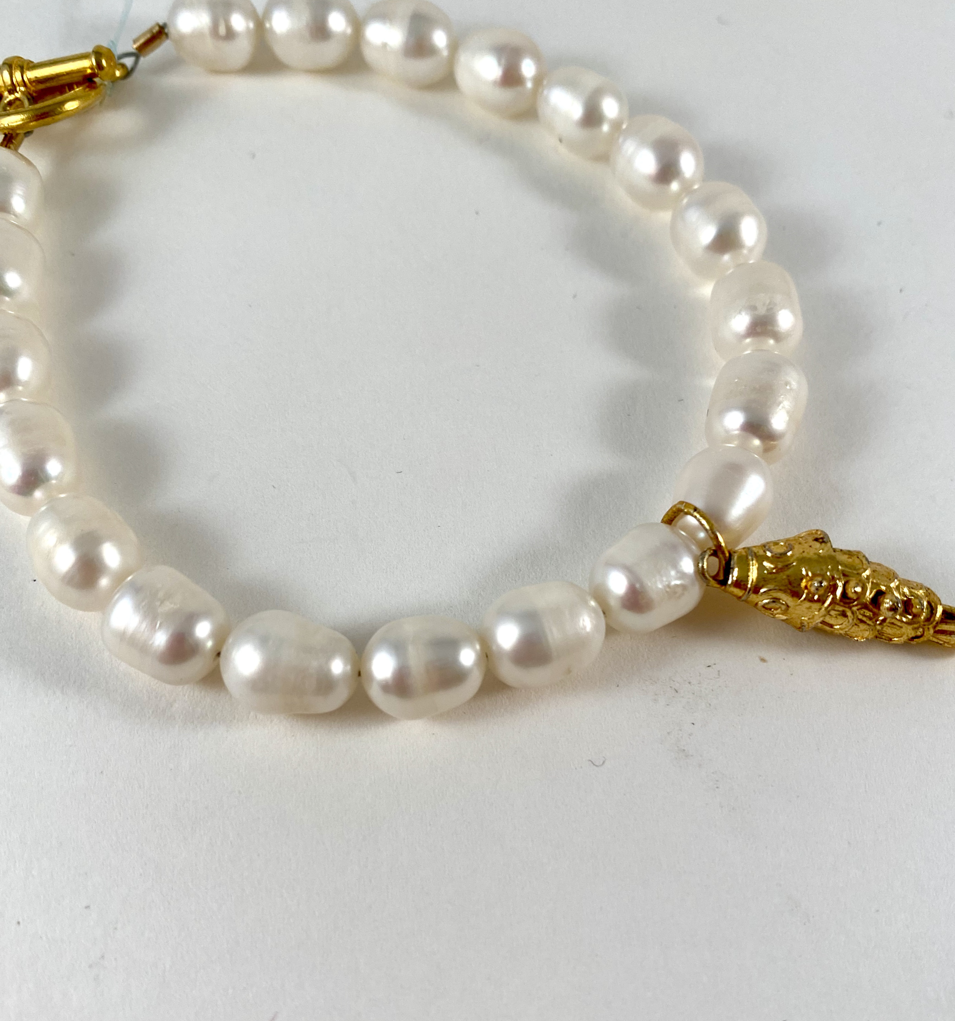 White Pearl Bracele, brass fish charm and clasp P17 by Nance Trueworthy