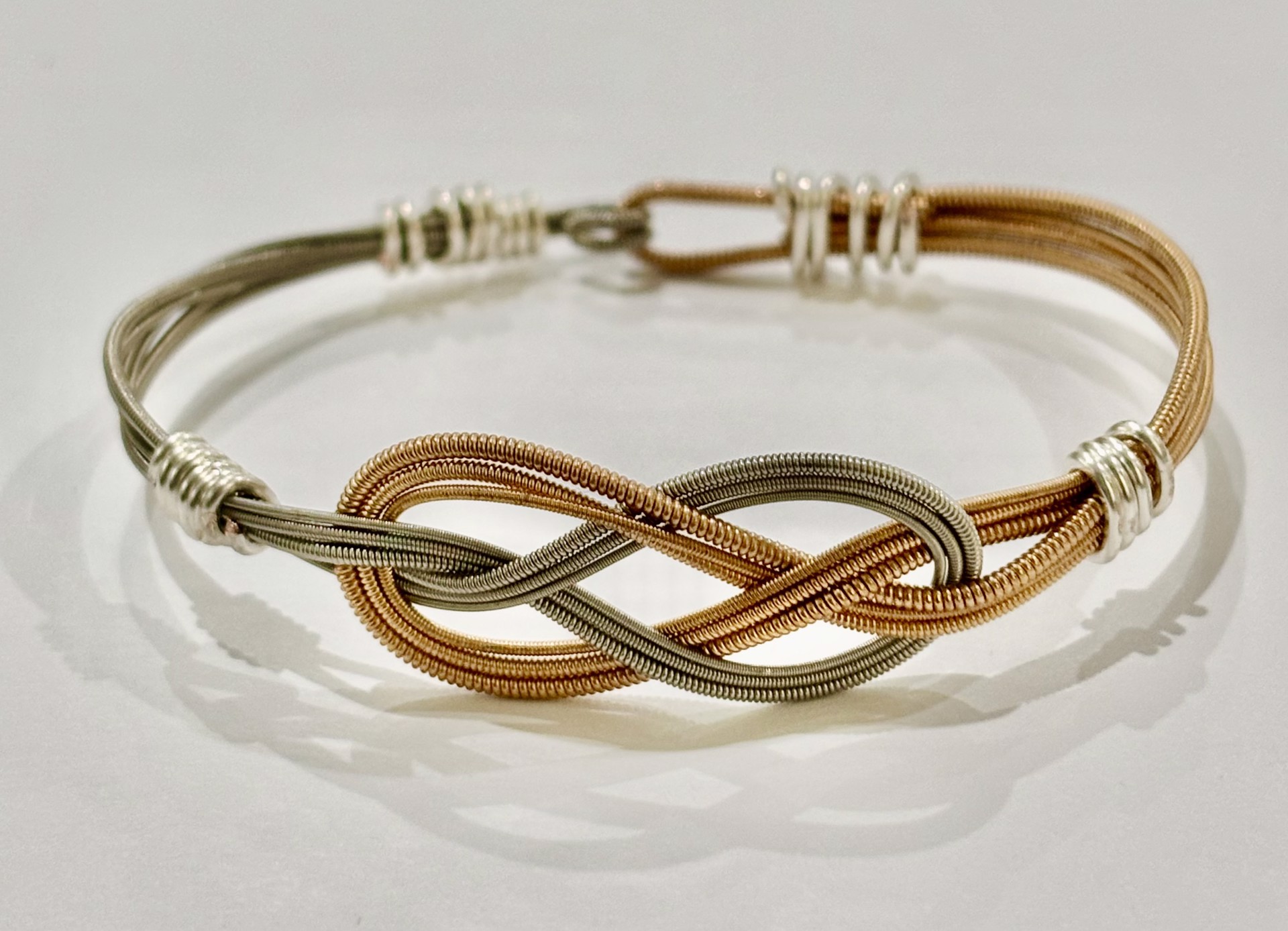 Silver and Rose Guitar String Infinity Bracelet by String Thing Designs