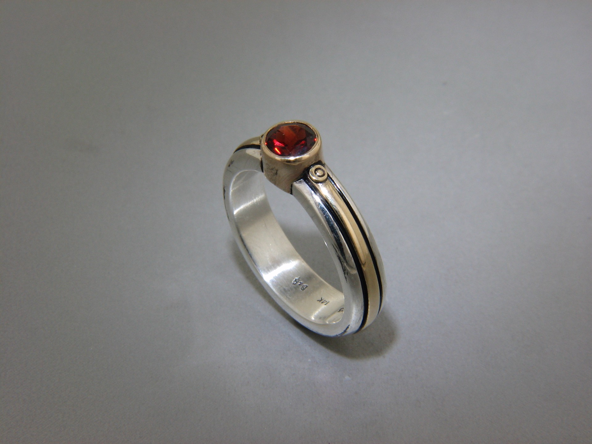 Single Garnet Ring, size 7.5 by DAVID & RONNIE