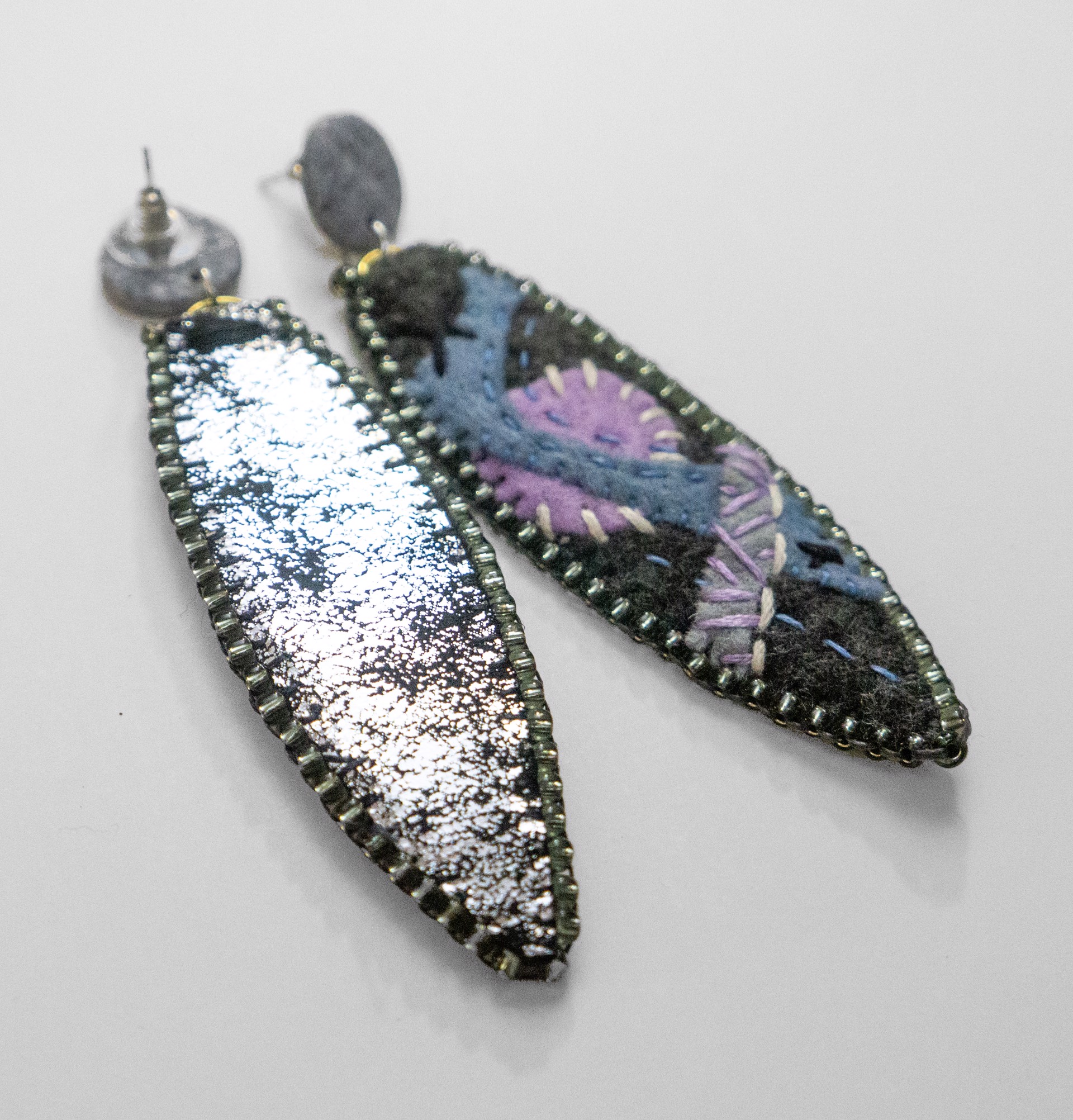 Grey embroidered earrings by Hattie Lee Mendoza