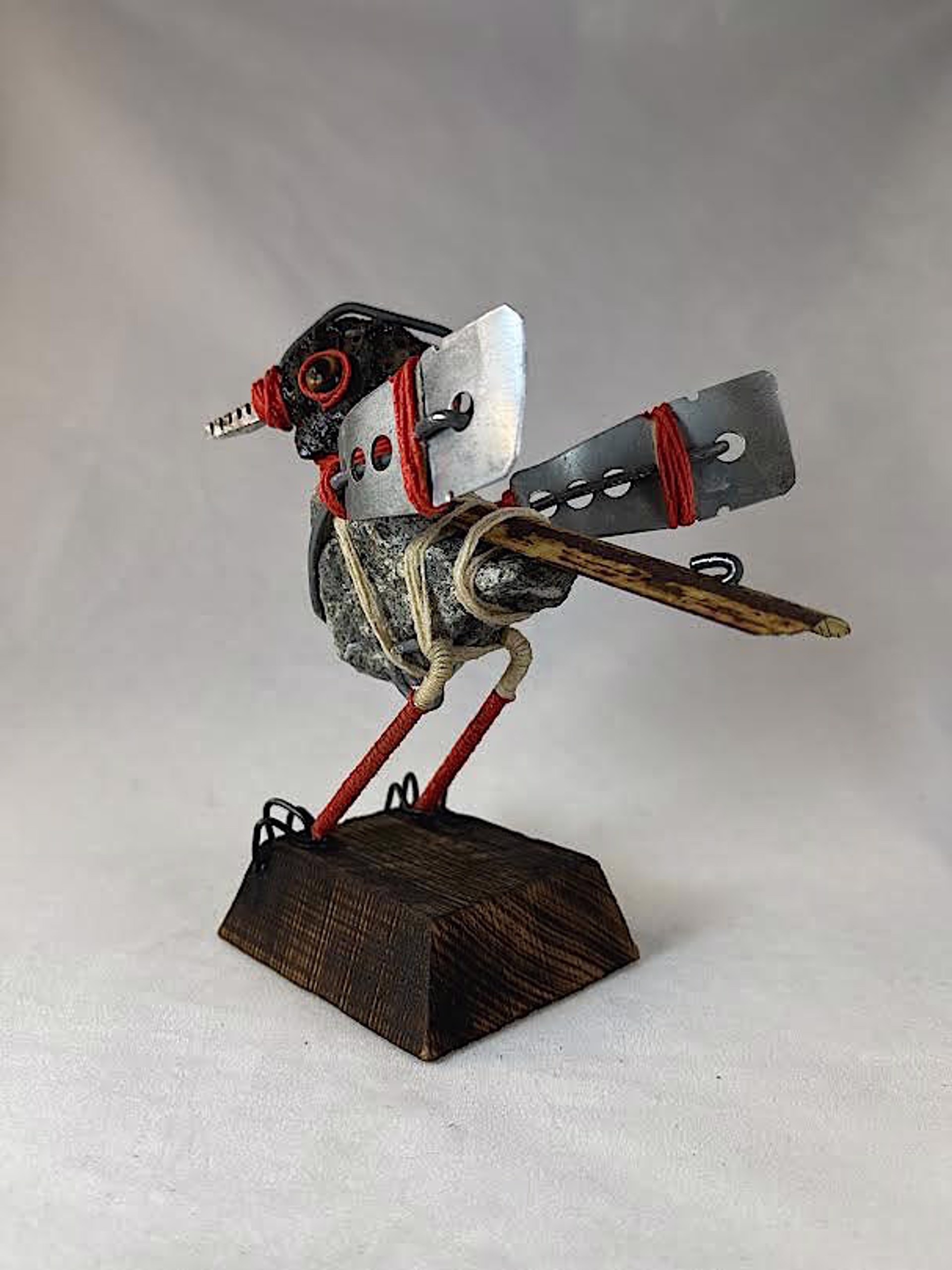 RED BANDED METAL WING by Andrew Bascle