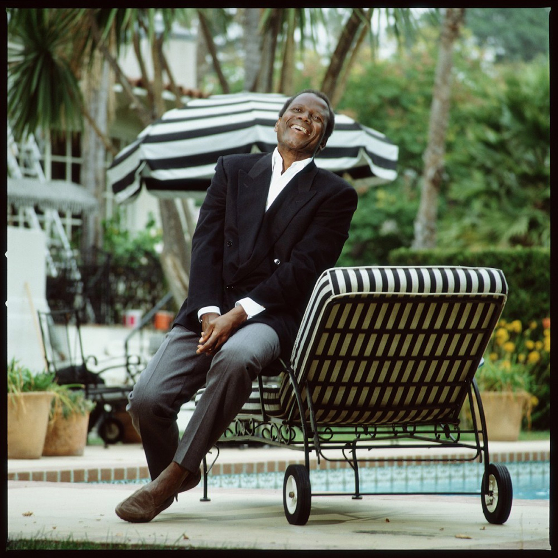 87125 Sidney Poitier Laughing on the Chaise Color by Timothy White