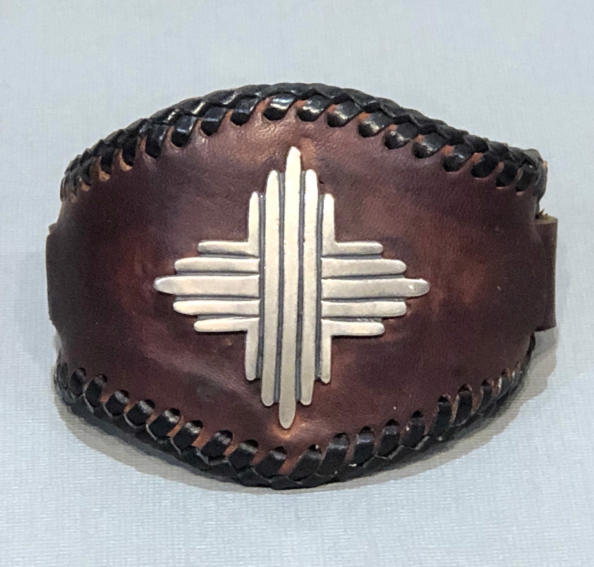 Silver Sun leather cuff bracelet by Glenn Green Galleries
