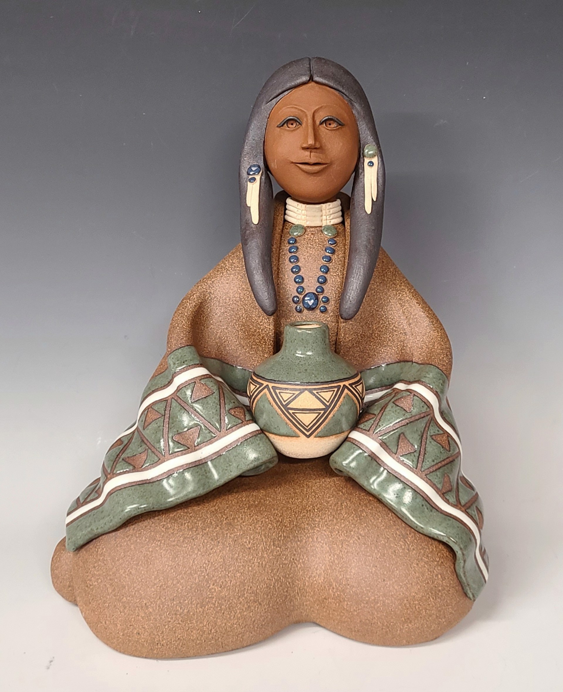 Lakota Woman Seated - Green by Terry Slonaker