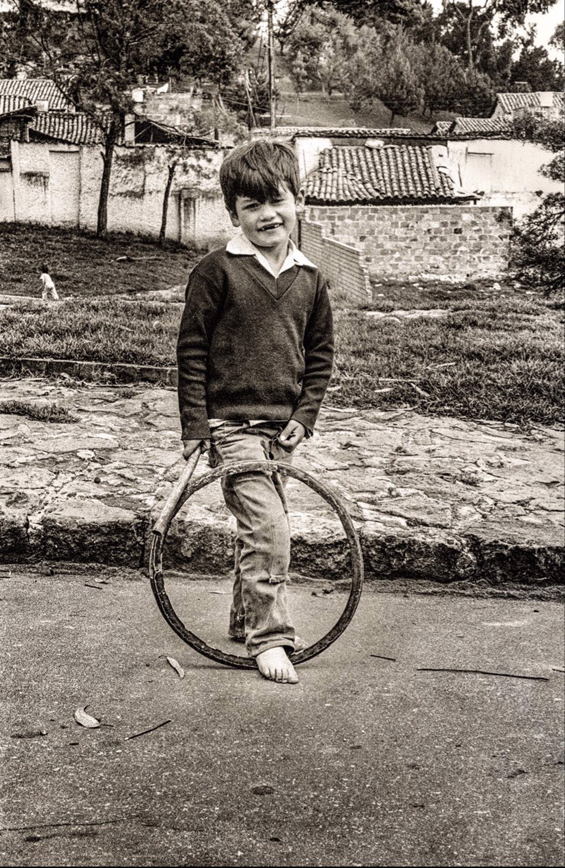 Boy And Bike Rim, Unframed (032) by Jack Dempsey