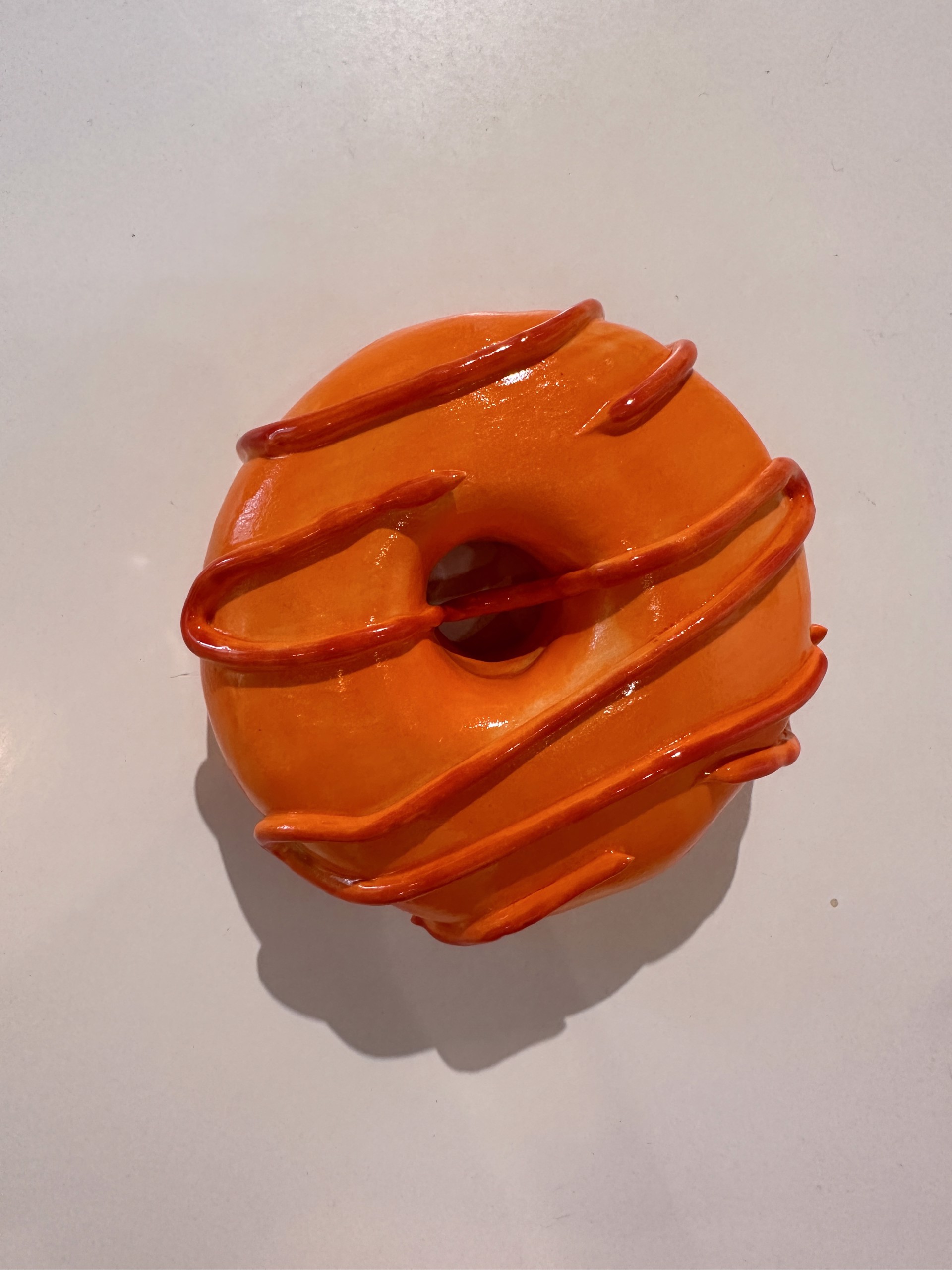 Orange donut by Liv Antonecchia