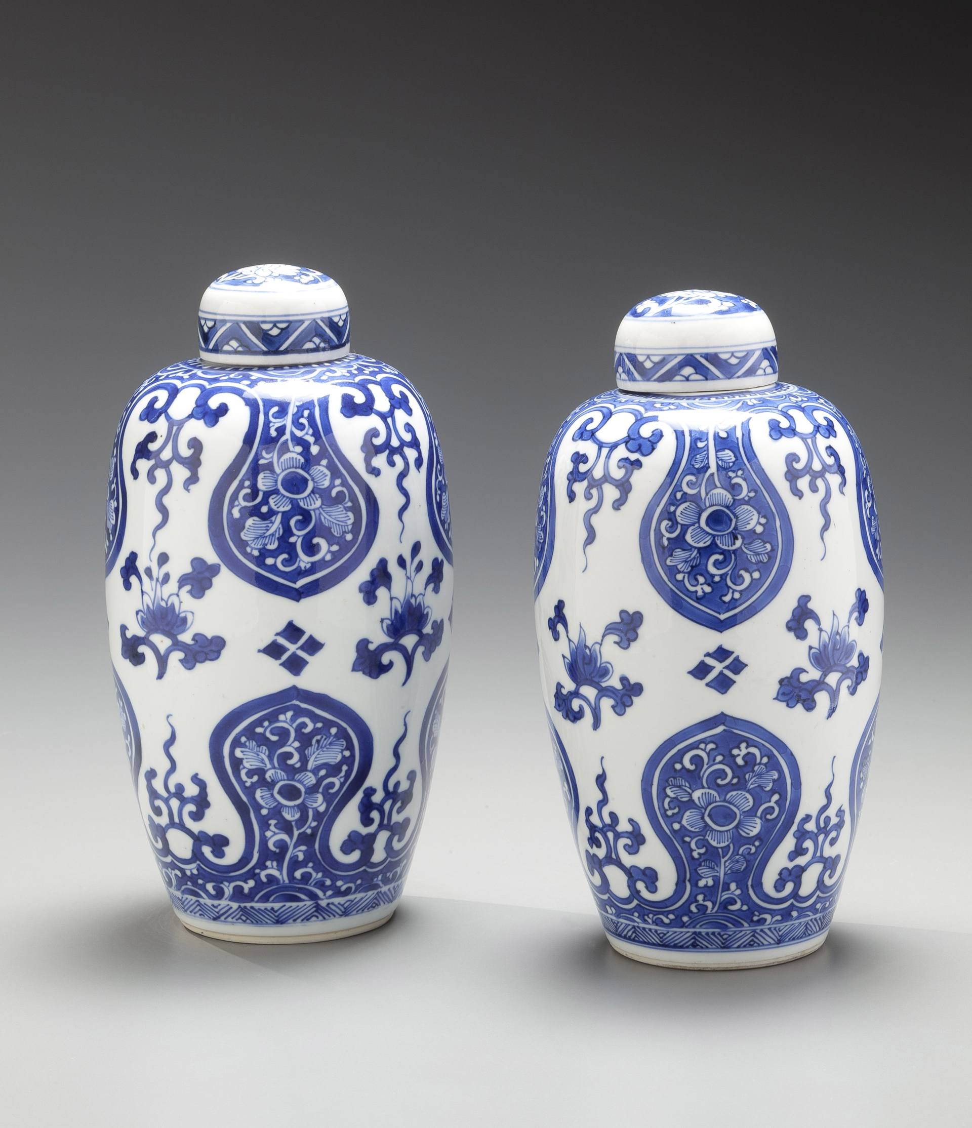 PAIR OF BLUE AND WHITE OVOID JARS AND COVERS