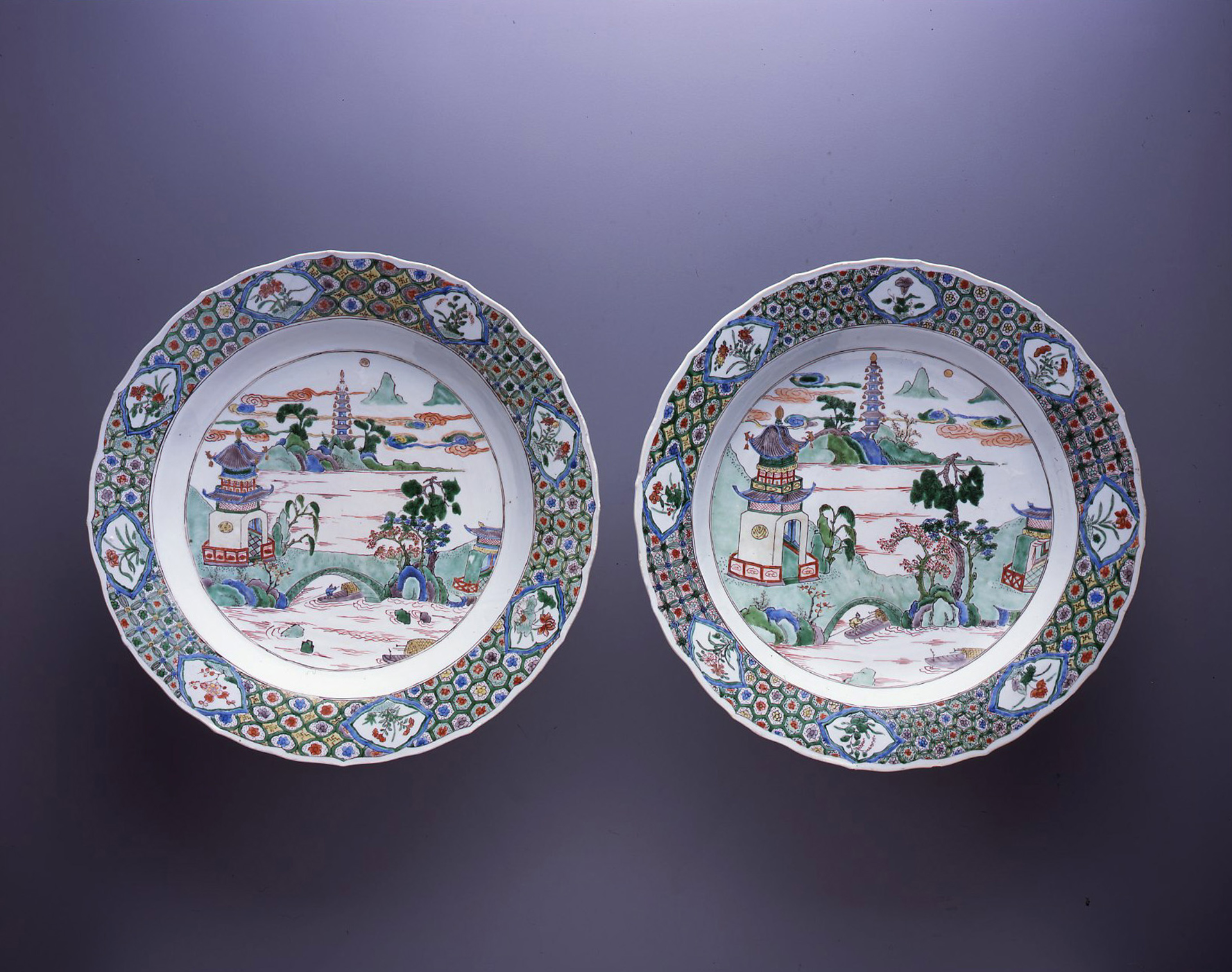 PAIR OF FAMILLE VERTE DISHES WITH RIVER LANDSCAPES