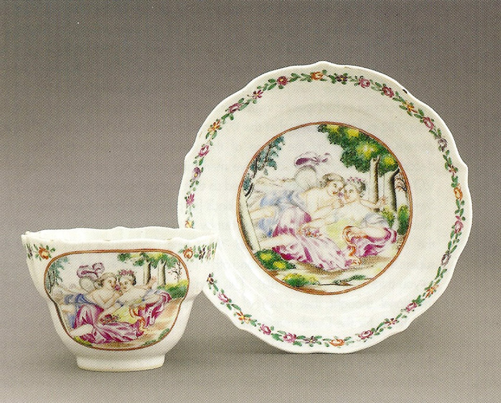 LARGE FAMILLE ROSE TEACUP AND SAUCER WITH CUPID AN PSYCHE