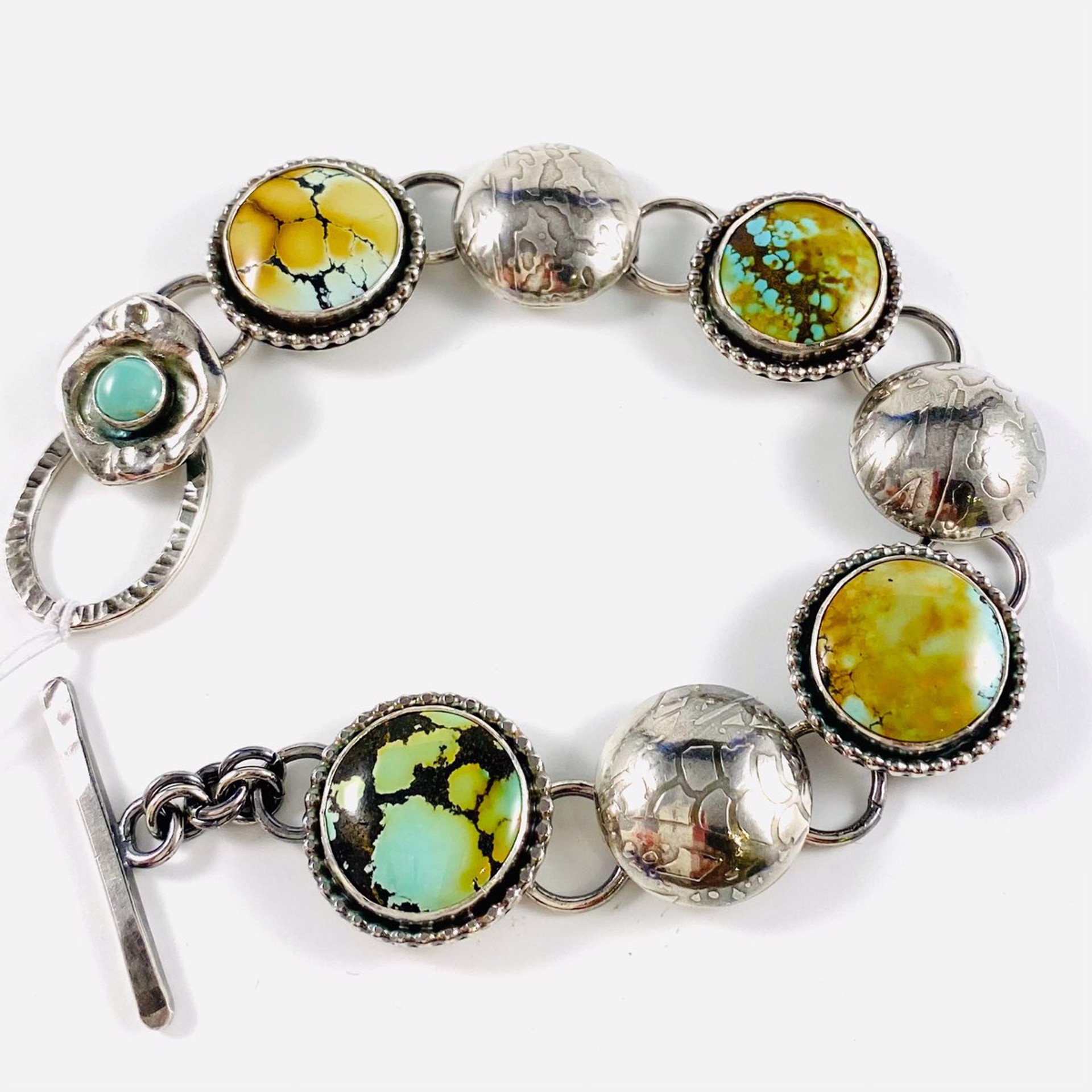 AB22-79 Four Treasure Mountain Turquoise Rounds with bead bezel and Three Silver Dome spacers Link Bracelet by Anne Bivens