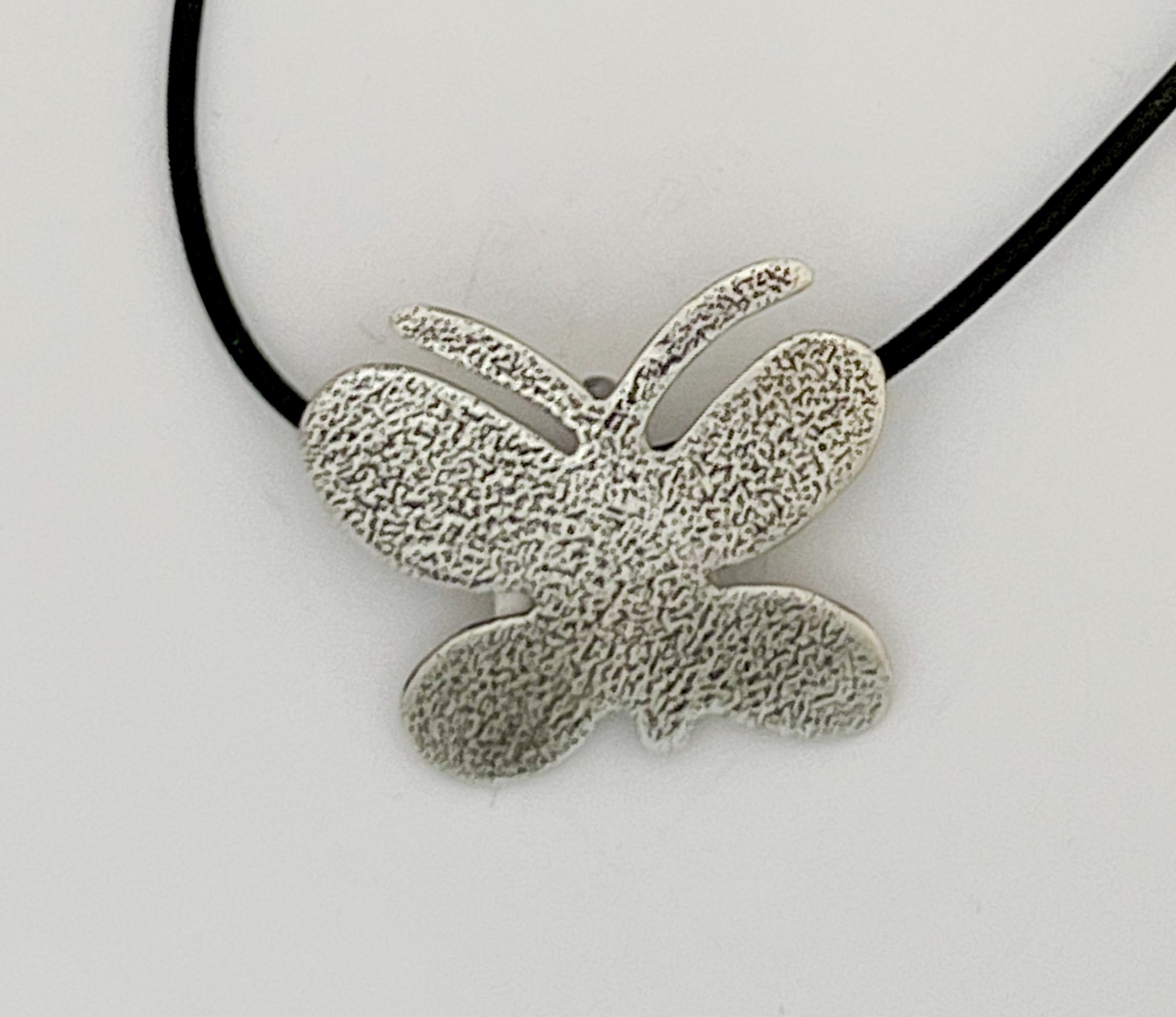 Textured Butterfly pendant by Melanie A. Yazzie