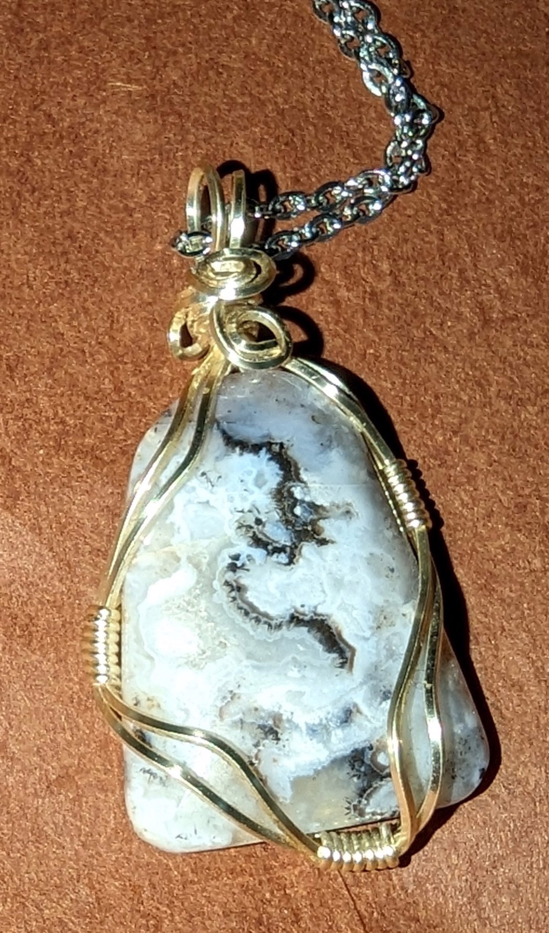 Sagenite agate pendant by Betty Binder