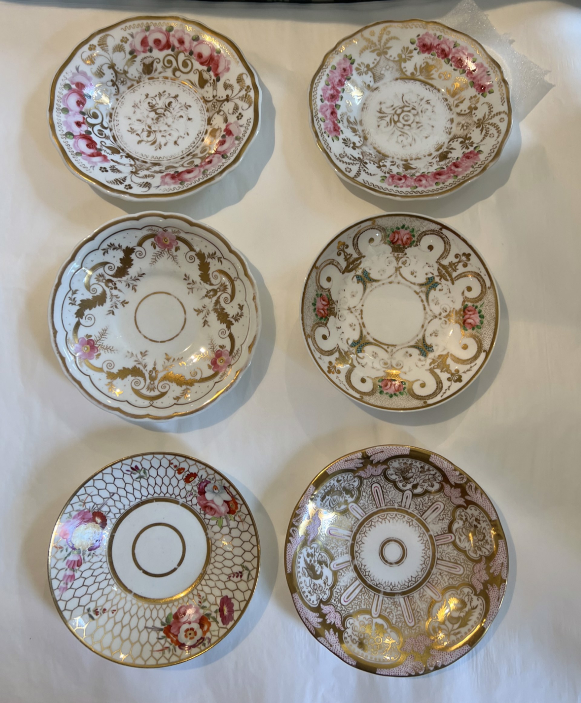 GROUP OF SIX SMALL SAUCERS