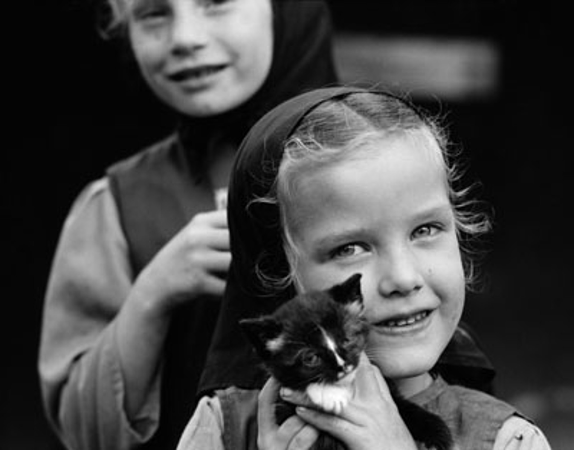 Mennonite Girl with Kitten by Don Dudenbostel