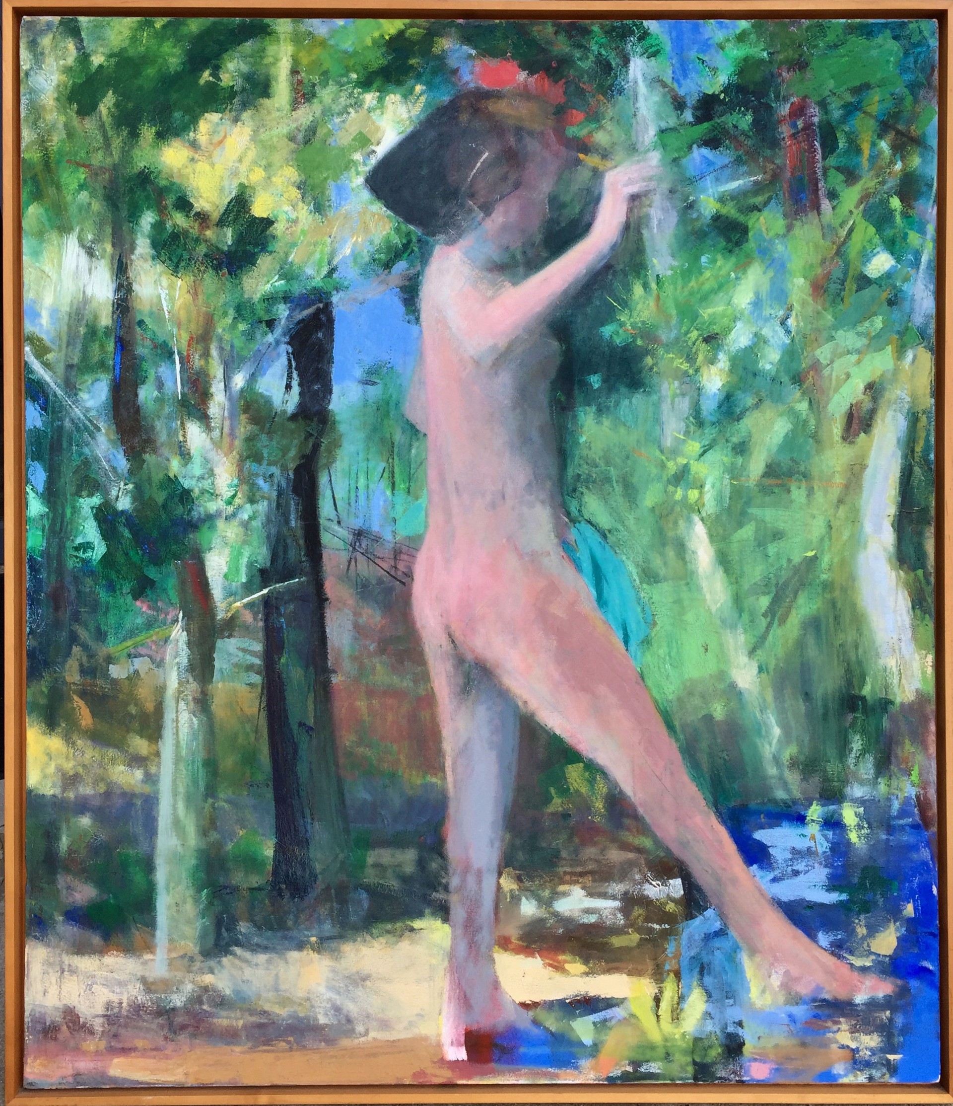 A stylized female bather in profile dips her toe into a stream. Behind is a rich woodland landscape