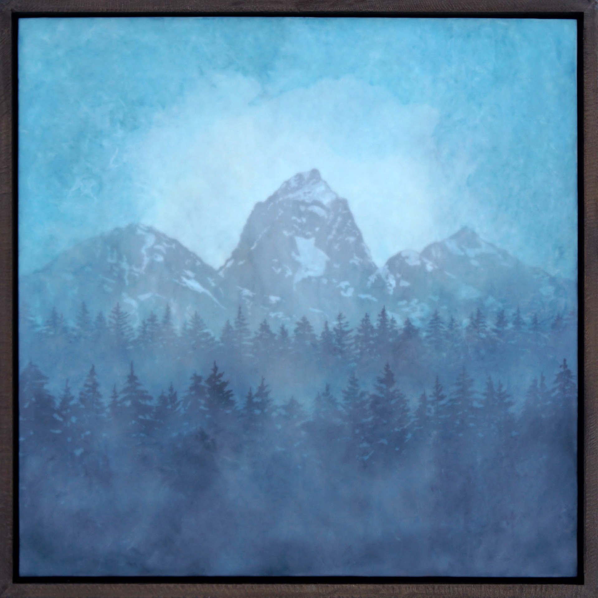 Original Encaustic Landscape Painting Featuring Mountain Peak And Pine Trees through Hazy Blue Tinted Clouds