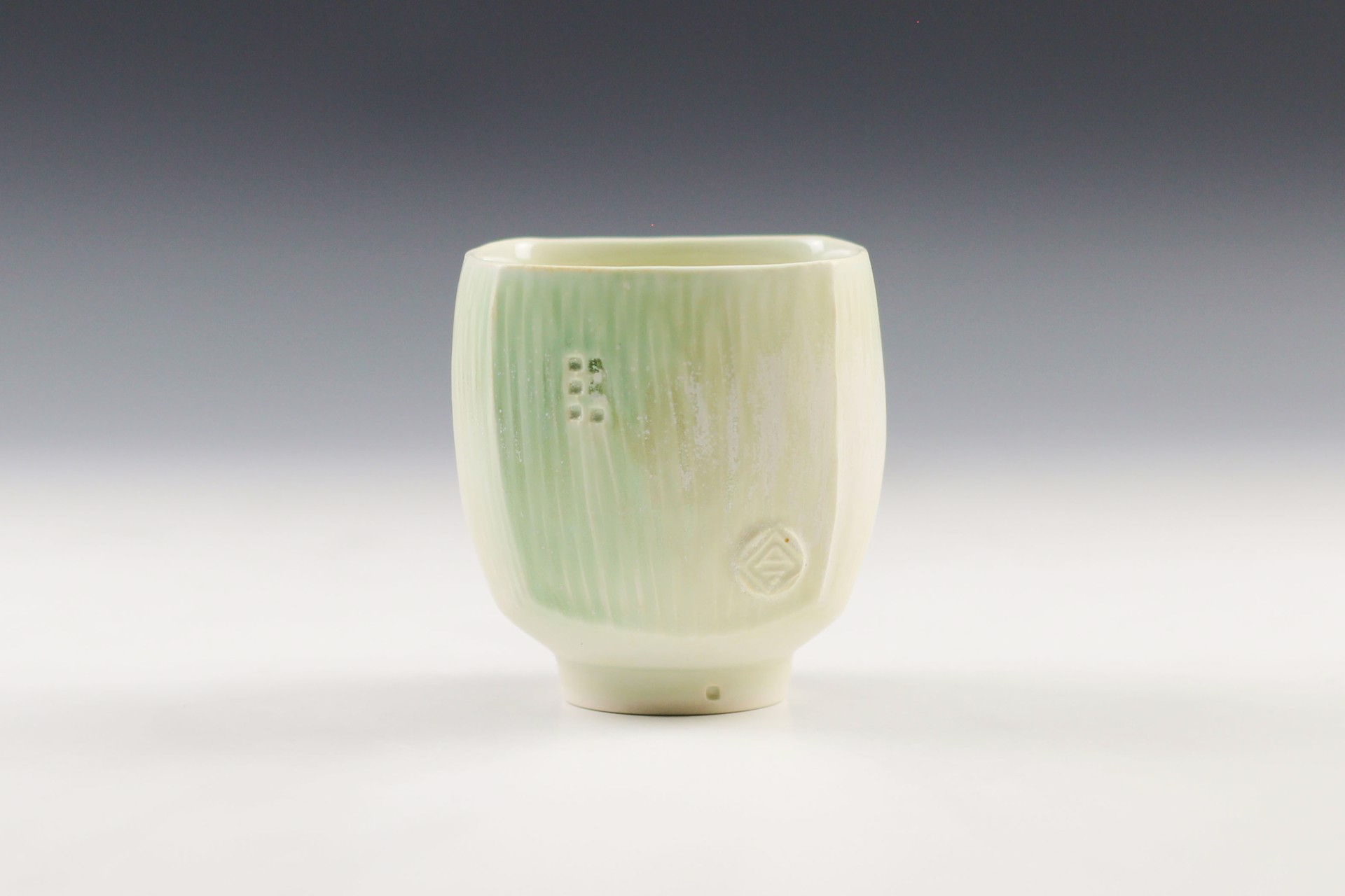 Square White and Green Cup by Nick DeVries