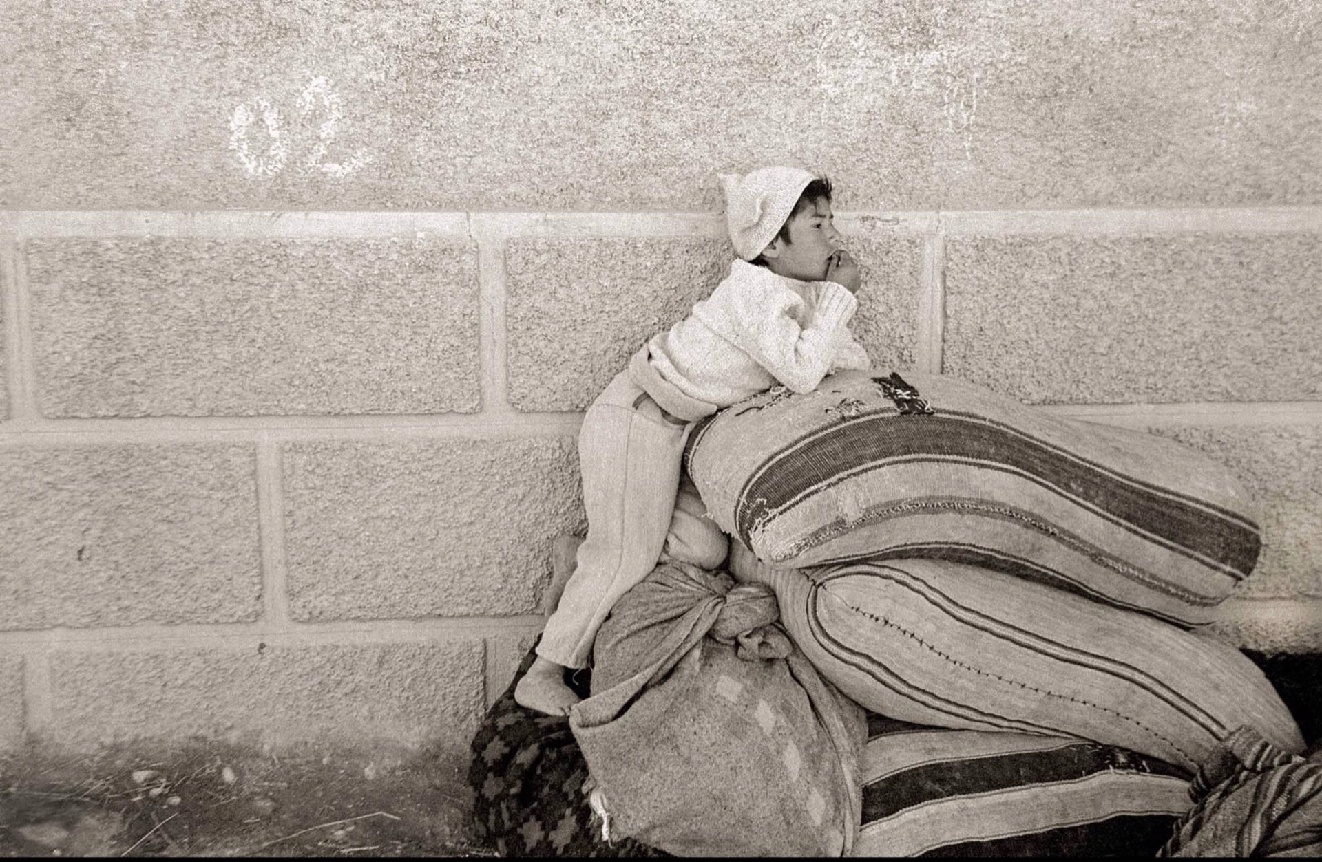 Boy on Grain Sacks, Framed (065) by Jack Dempsey