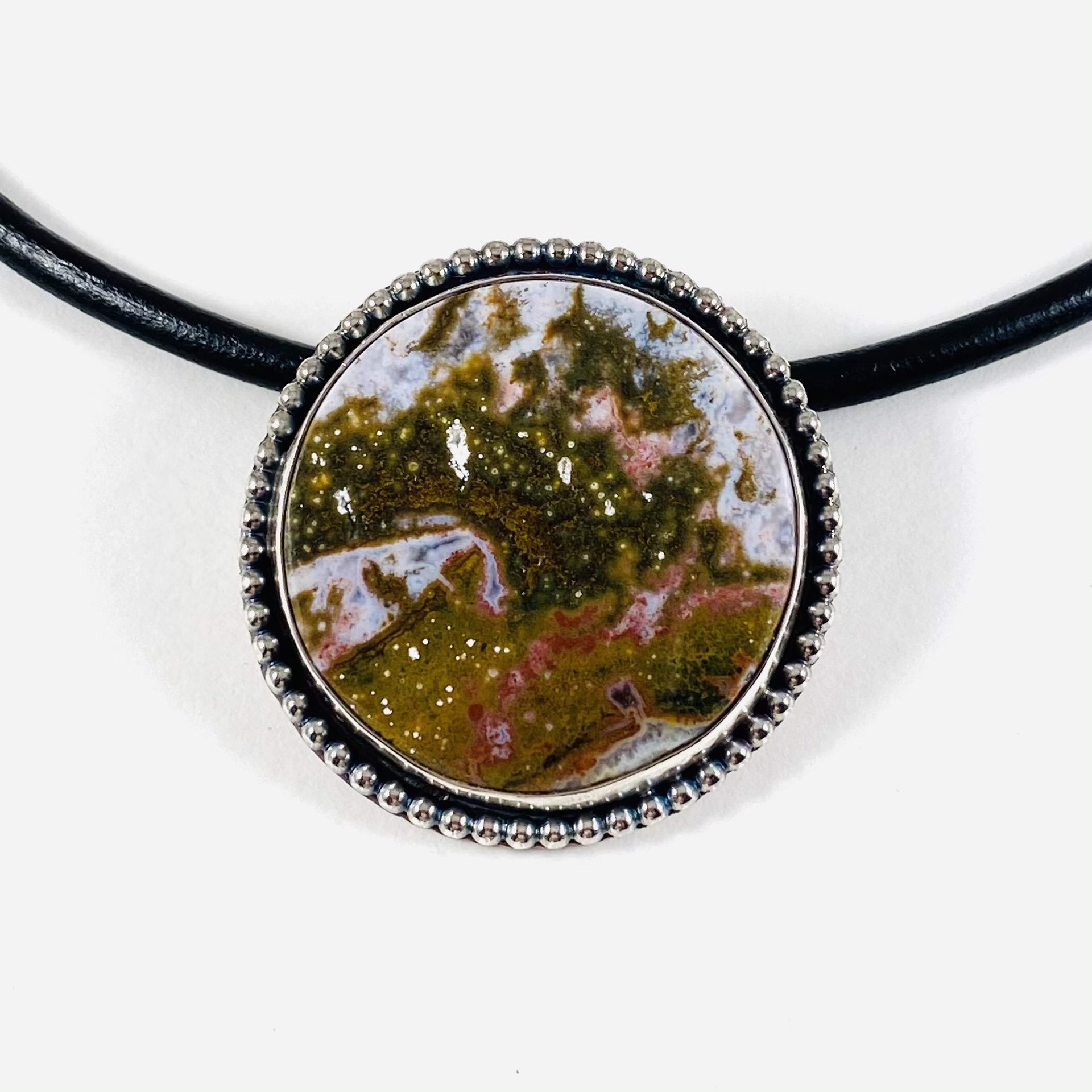 AB21-32 Ocean Jasper, Silver Pendant on leather by Anne Bivens