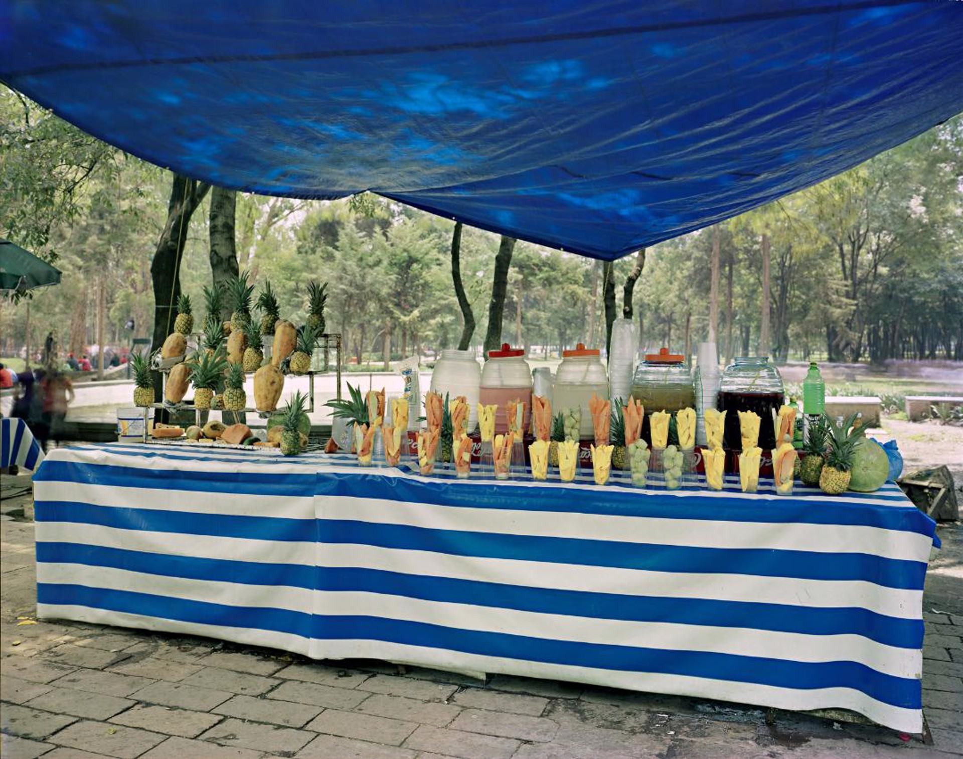 Fruit Juice Stand at . . . by Jim Dow