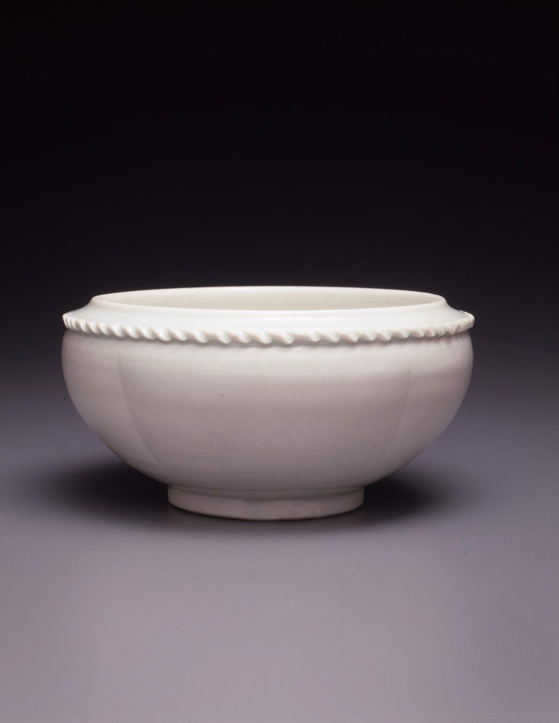 WHITEWARE BOWL WITH A SCROLLED EDGE by 