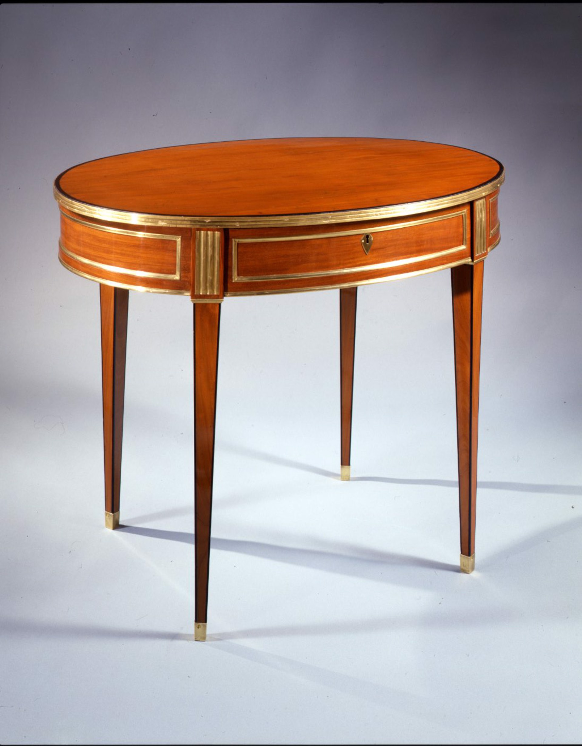 RUSSIAN BRASS MOUNTED MAHOGANY OVAL TABLE