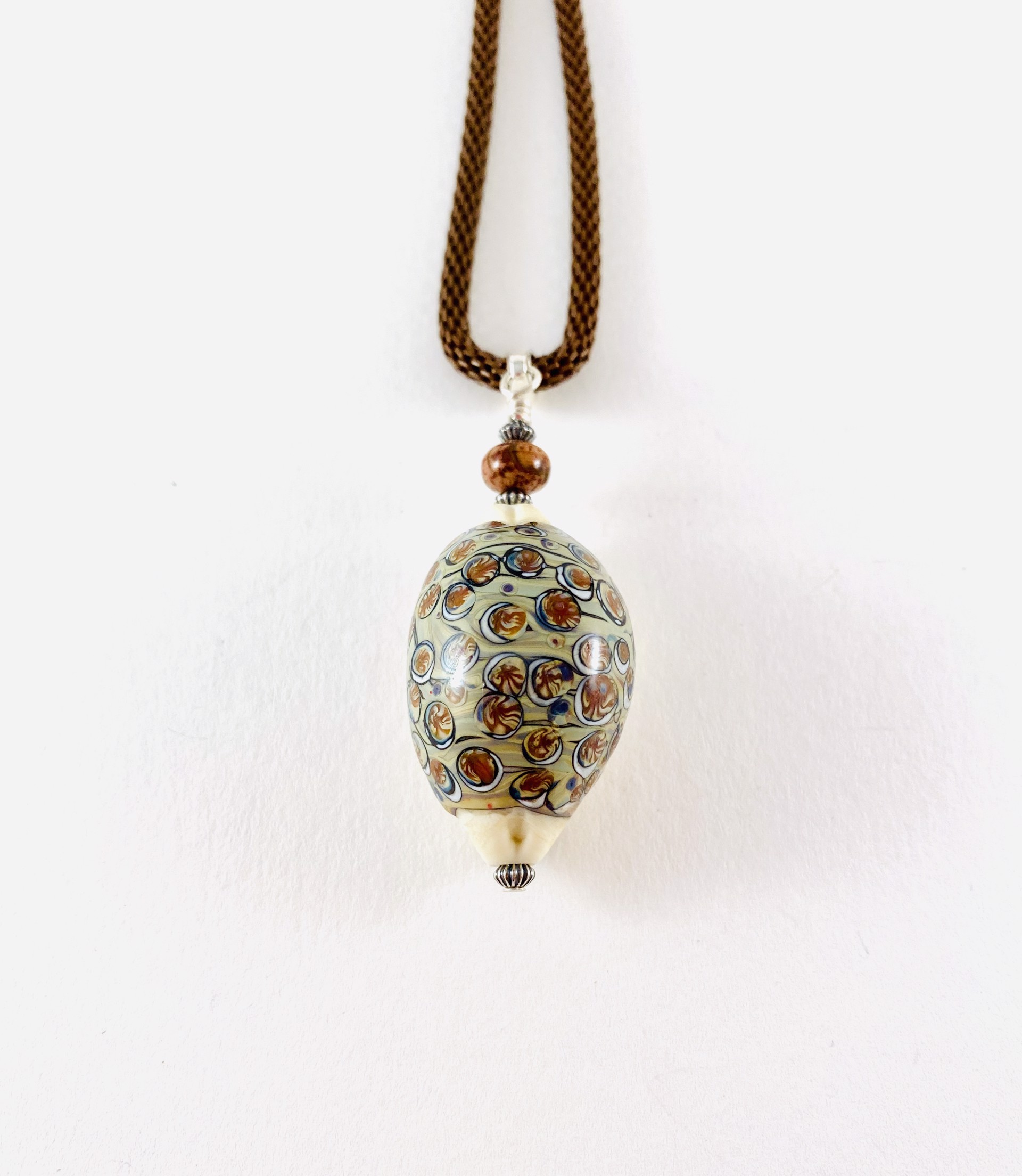 Cowrie Shell Pendant, mesh necklace by Linda Sacra