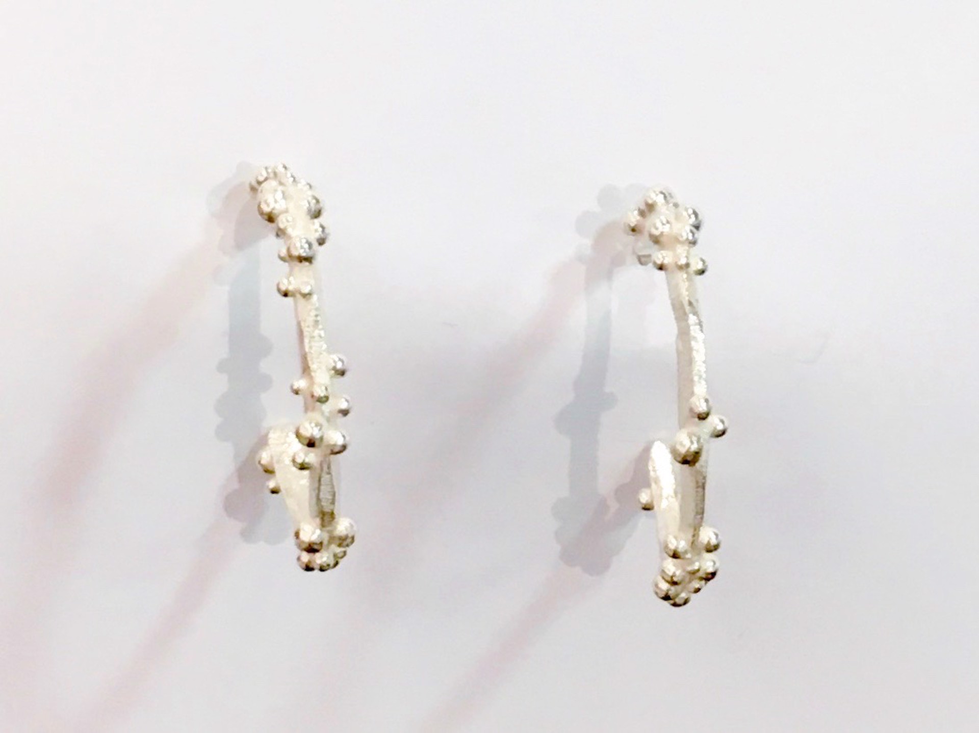 Silver Hoop Earrings by DAHLIA KANNER
