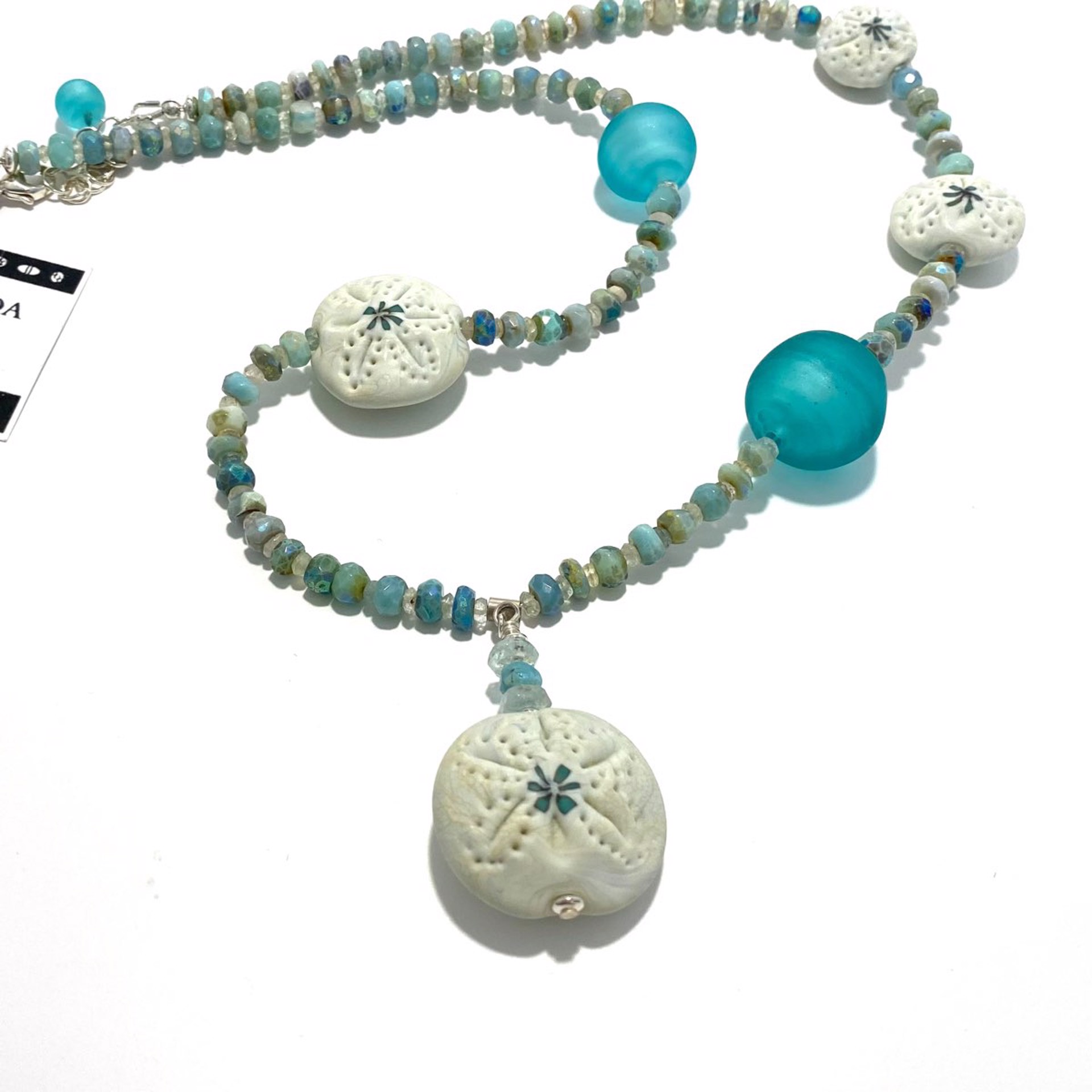 Ivory Sand Dollar Pendant on Ivory and Teal Glass Bead and Gemstone Necklace LS22-467N by Linda Sacra