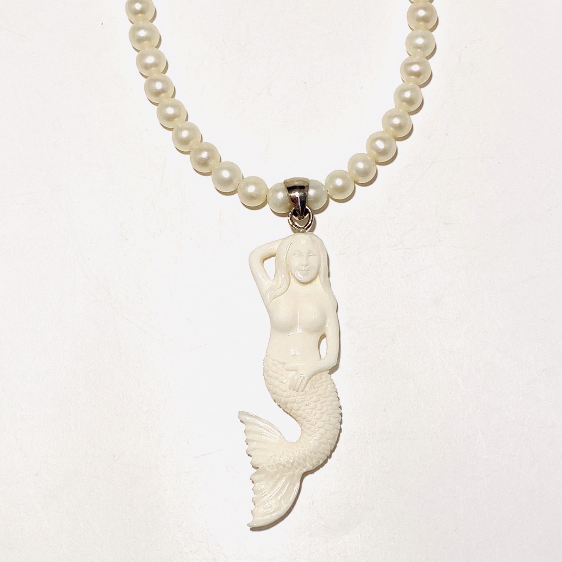White Pearl Carved Bone Mermaid (Bali) Pendant Necklace by Nance Trueworthy