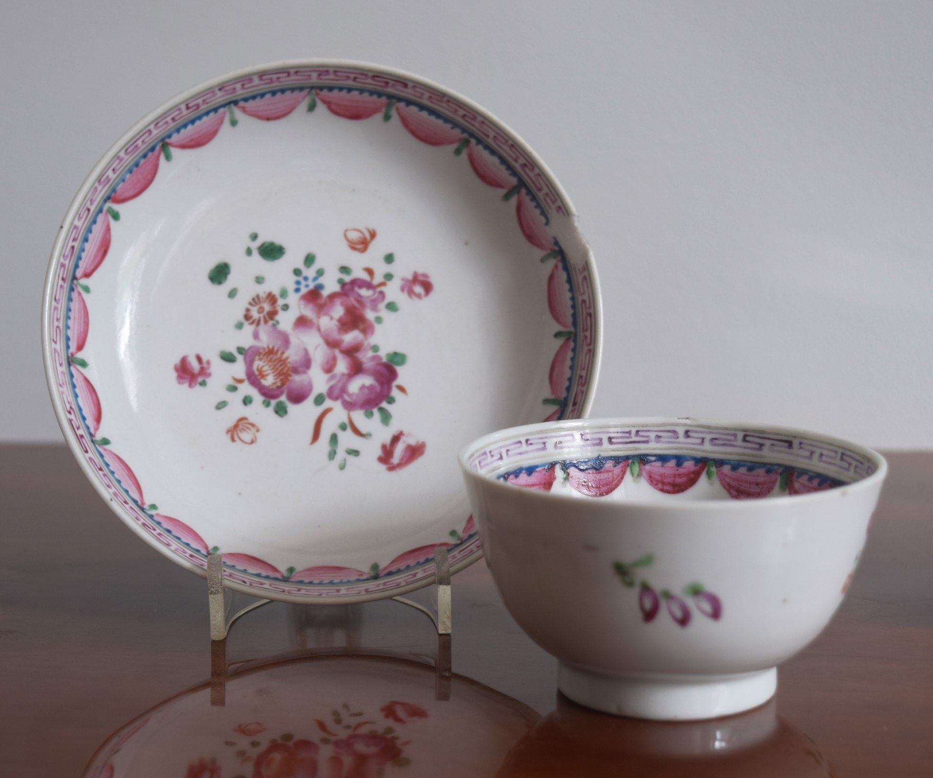 A FAMILLE-ROSE CUP AND SAUCER IN THE ENGLISH STYLE