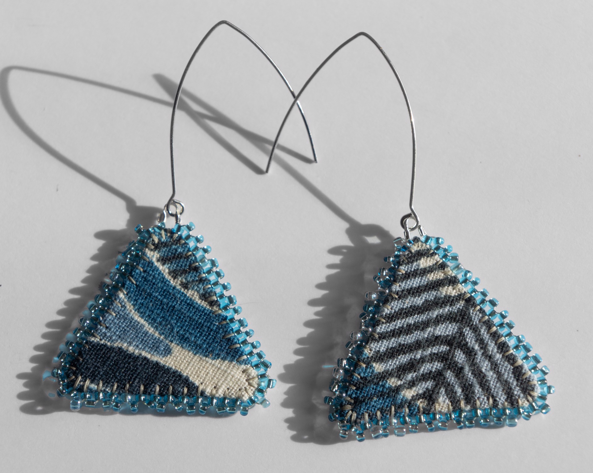 Blue triangle earrings by Hattie Lee Mendoza