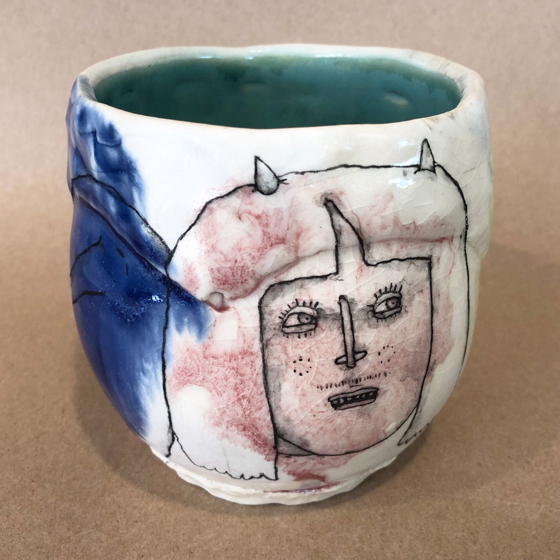 China Clay Cup: Two Faces by Lynne Hobaica