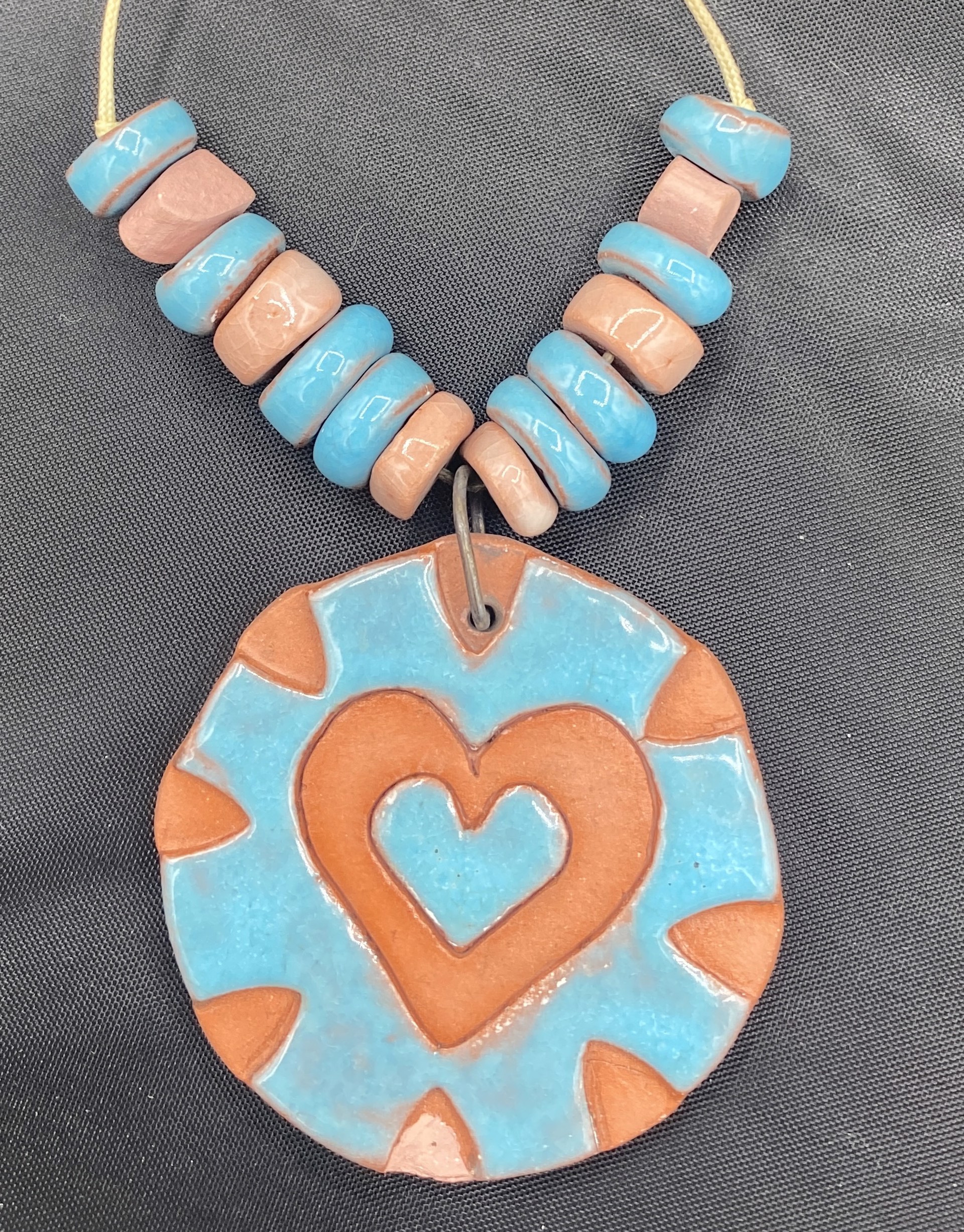 1.75" Turquoise and terracotta heart pendant with beads by Stella Sullivan