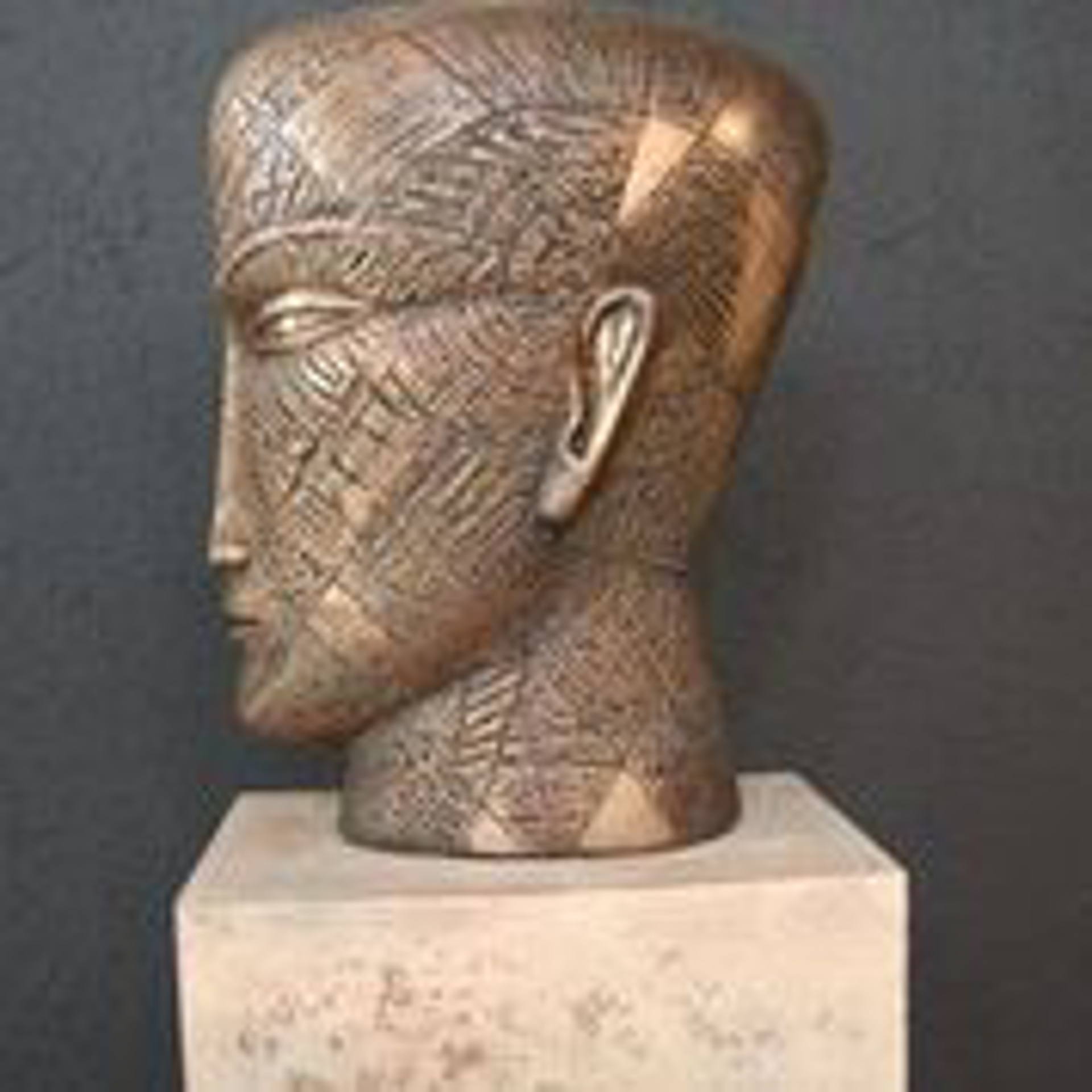 Bronze Head with Triangles by Anton Smit