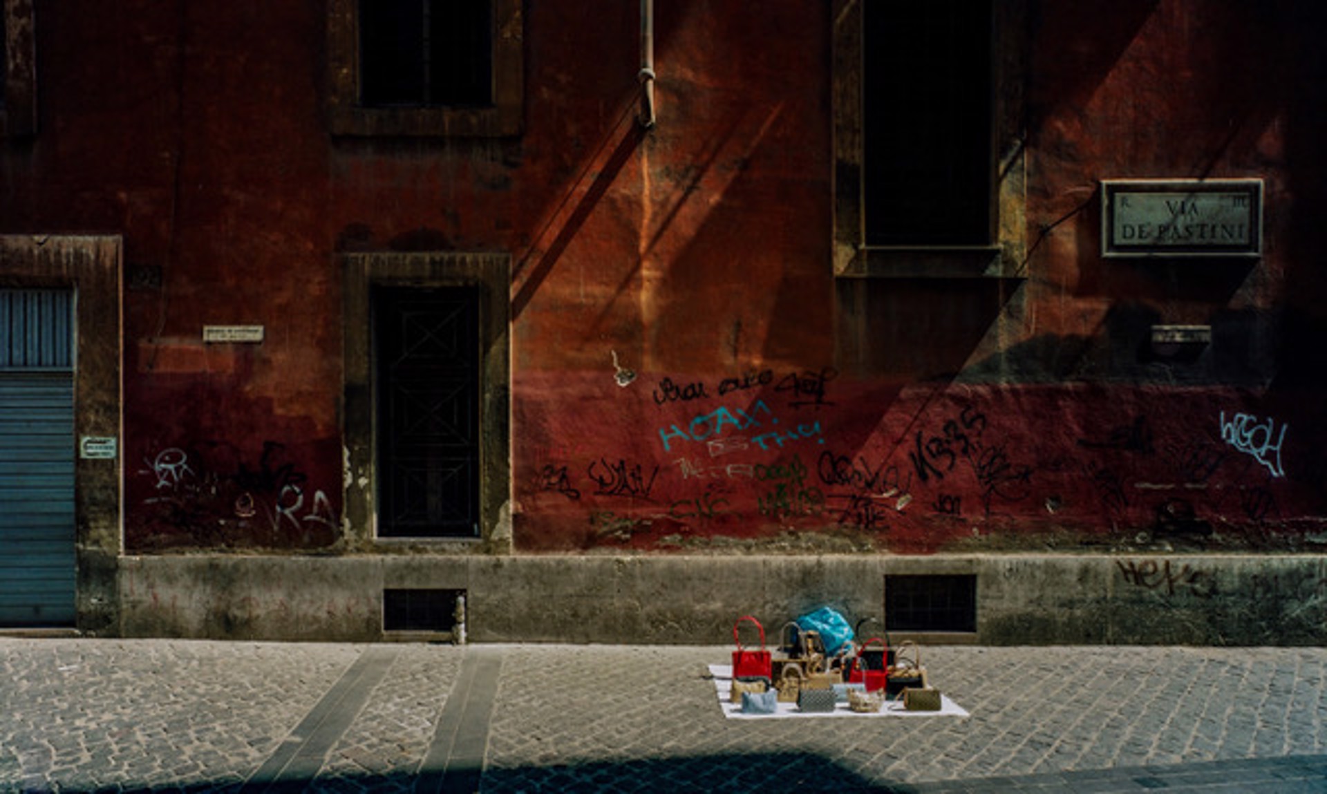 Fake Designer Handbags, On the Streets, Rome, Italy by Lawrence McFarland