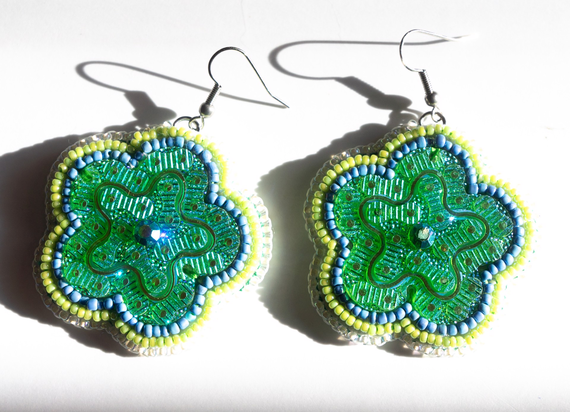 Green beaded floral earrings by Hattie Lee Mendoza