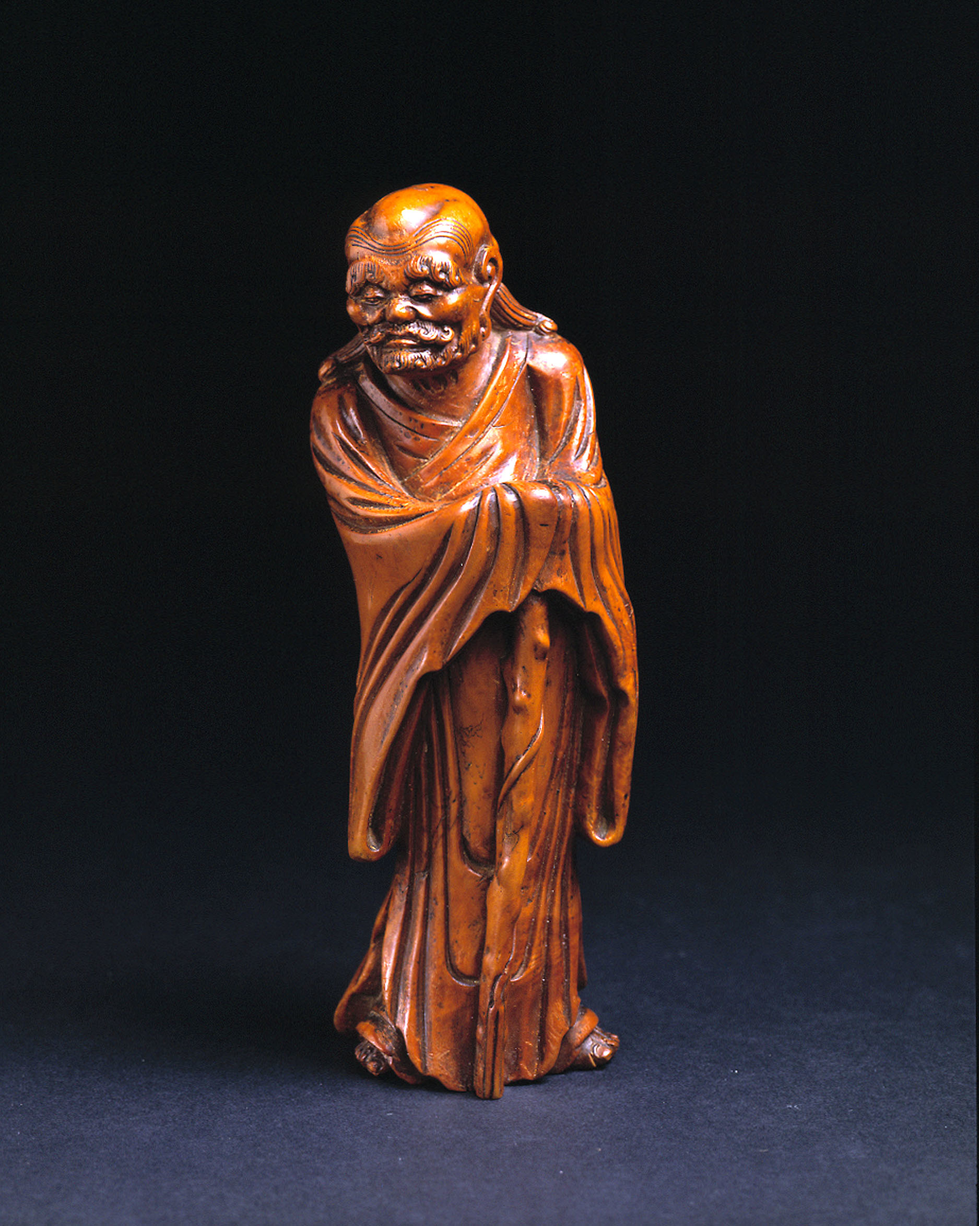 BOXWOOD CARVING OF A GENTLEMAN WITH STAFF