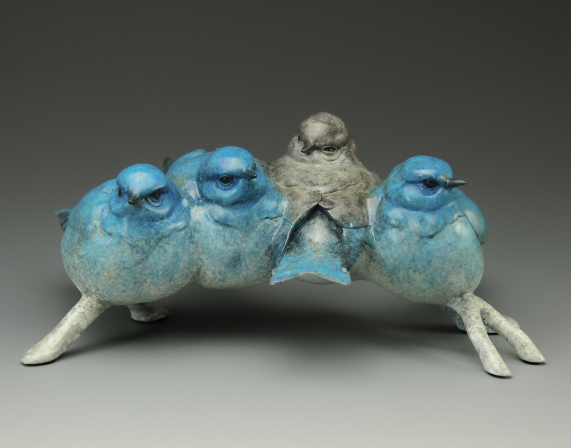 A Contemporary Bronze Of Four Bluebirds Balancing On A Branch In The Winter At Gallery Wild