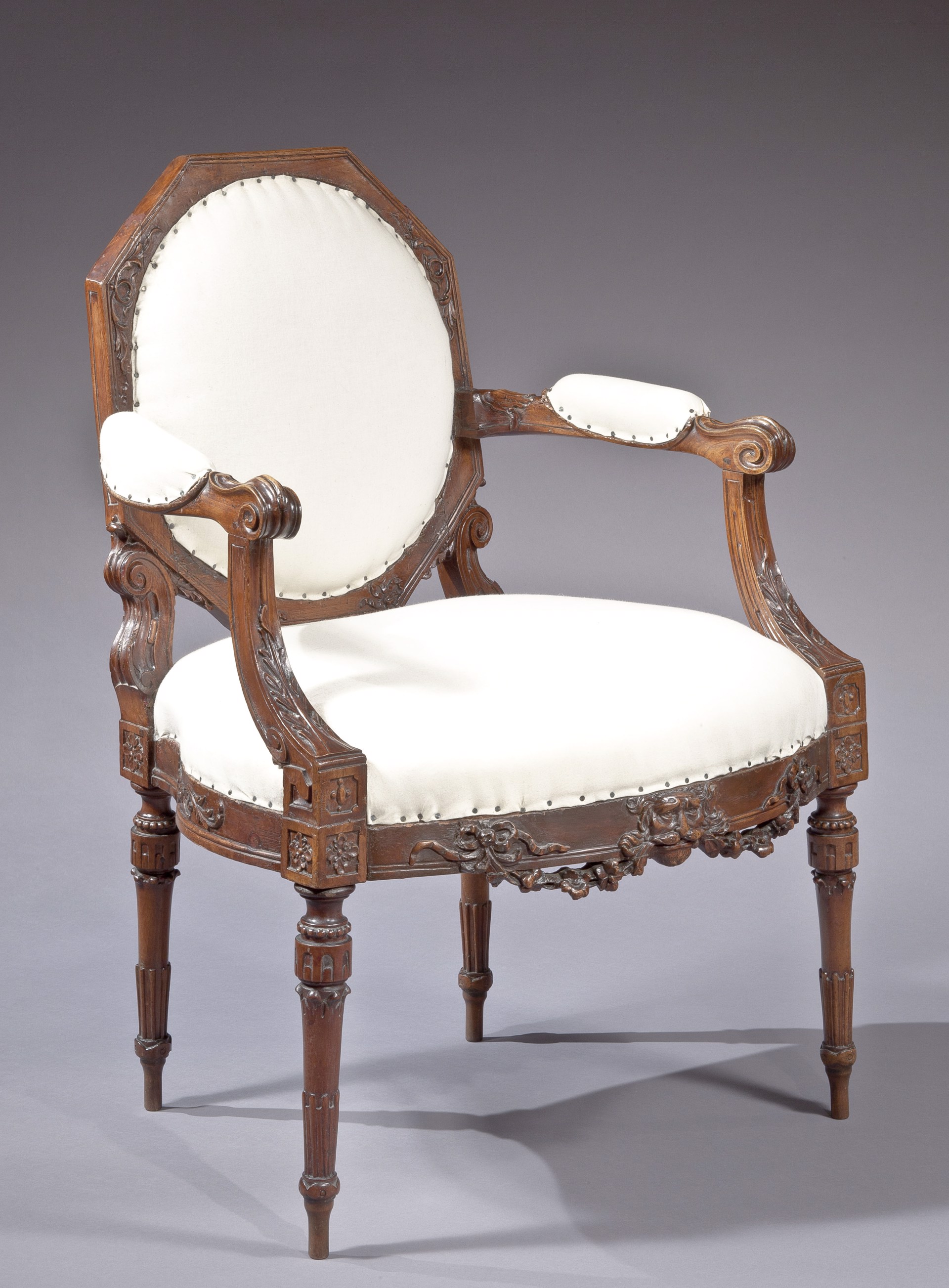 UNUSUAL CONTINENTAL NEOCLASSICAL CARVED MAHOGANY ARMCHAIR