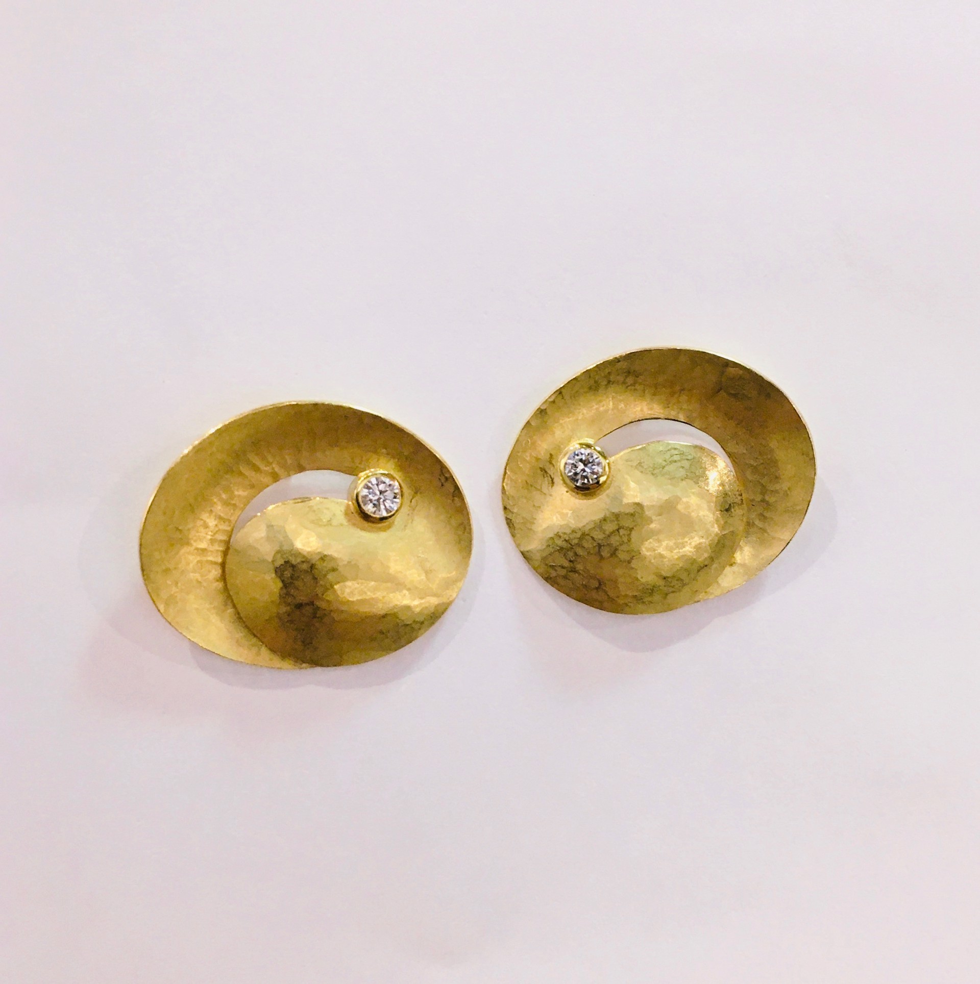 18kt diamond swirl earrings by AYESHA MAYADAS