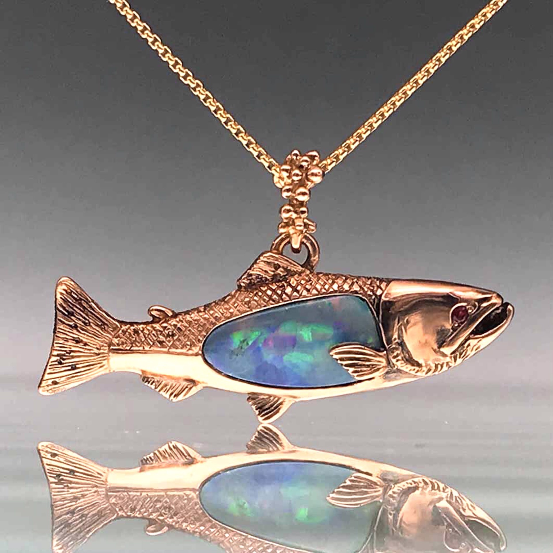 Salmon Pendant with Opal Inlay, Ruby Eye by Thomas Tietze